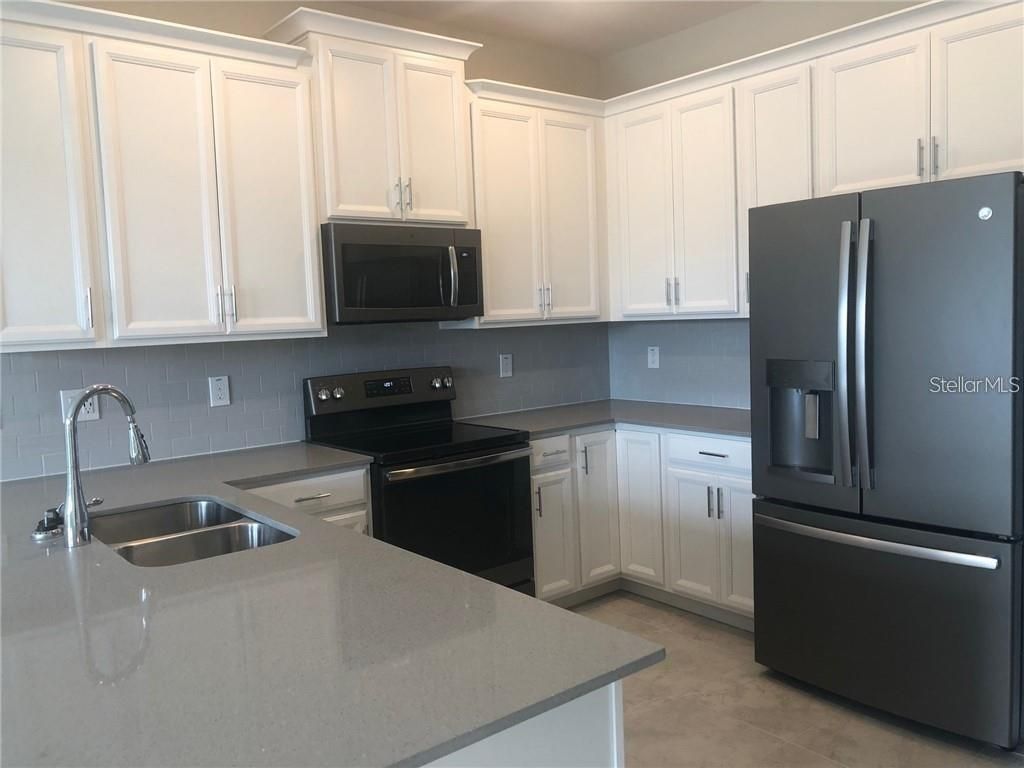 Photo of 4622 Tribute Trail, Kissimmee, FL 34746 (MLS # O6376596)