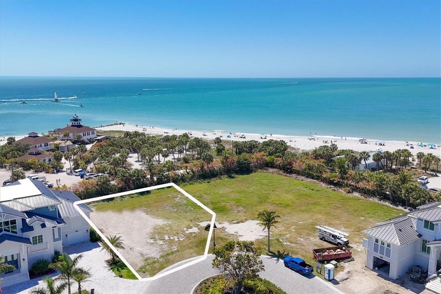 A magnificent home site with extraordinary panoramic views of the Gulf of Mexico and Boca Grande Pass.  Build your dream, luxury custom home with any builder you choose on one of the most sought-after islands in Florida.  Lot #6, perfectly named the "The Lighthouse Lot", for its dramatic view of one of Boca Grande's most iconic landmarks, the 1890 built Port Boca Grande Lighthouse.  Your new luxury home will enjoy the coveted south and westerly exposures bringing sunshine onto your pool lanai all day and gorgeous sunsets in the evening.   Included with the property are masterfully designed plans for a 4,700 sq.ft. home.  Hill Tide Estates is the newest development in Boca Grande and is brilliantly designed with an incredible waterfront location at the southern tip of the Island.  The gated neighborhood features 19 luxury properties, a private tiered beach, and a unique private fishing and observation pier in Boca Grande Pass for Hill Tide residents.  Walk to the beach, take a short golf cart ride to the historic village of Boca Grande, facilities of the Gasparilla Inn, or experience some of the world's best Tarpon and back water fishing.