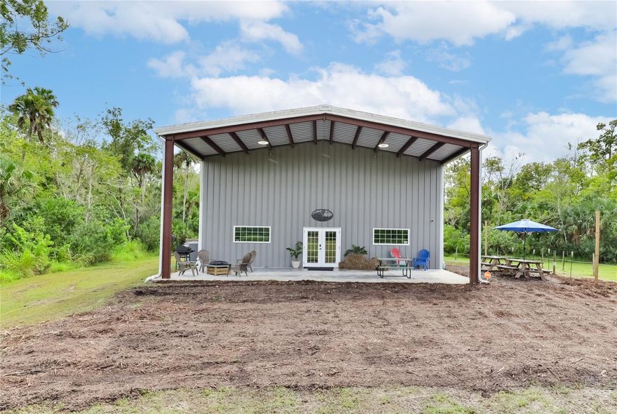 Discover your own slice of paradise at Family Tree Farms in Oakhill, FL—a serene and beautiful active working farm. Here, you can unwind, connect with nature, and enjoy the tranquility of 15 lush acres. Wander through nature trails, watch resident wildlife, or relax by the ¾ acre fish-filled pond. Explore manicured grounds with fruit trees, date palms, and more.
As you approach the 3,200 sq ft barn with a covered patio, you'll find a grand ballroom with 20' ceilings and a hand-built bar. This versatile space includes a commercial kitchen, a bedroom, and a master suite. Outside, there's a workshop with power tools.
This property is also AG exempt, making it ideal for agricultural endeavors, and it comes with an existing bee lease in place. Additionally, there's a 34-month, $125,000 option to sell perpetual easement rights for 5 acres, making this property a unique agricultural haven.
Additional Information:
• The owners are offering for sale a 2001 John Deere 541 tractor with a frontend loader, Bushhog, and various attachments.
• The property boasts 150 Date Palms at various stages of growth. If maintained properly, each tree should appreciate to a value of $800 to $1,000 per tree within 3 to 4 years.