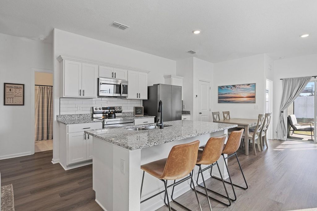 Photo of 8652 Sportsman Loop, Groveland, FL 34736 (MLS # O6374905)