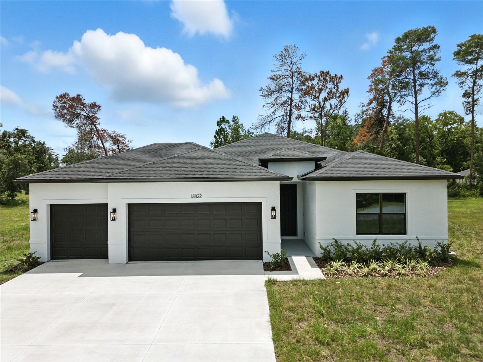 This stunning brand-new construction is fully completed and move-in ready, offering modern elegance, high-end finishes, and exceptional craftsmanship in a peaceful yet thriving community.
This spacious four-bedroom, three-bathroom home with a three-car garage features an open floor plan with soaring ceilings and an abundance of natural light. Luxury vinyl plank flooring flows through the main living areas, while cozy carpeting adds comfort in the bedrooms.
The gourmet kitchen is designed for both function and beauty, featuring quartz countertops, stainless steel appliances, a large center island, soft-close cabinetry, and a walk-in pantry. Quartz countertops continue in all the bathrooms, offering a sleek, cohesive look throughout the home.
The primary suite is a true retreat, offering his-and-hers walk-in closets and a spa-like ensuite with dual vanities and a glass-enclosed walk-in shower. A second bedroom also includes a private ensuite, making it perfect for guests or multigenerational living. The remaining two bedrooms offer flexibility for family, a home office, or hobby space.
Sliding glass doors lead to a covered porch—an ideal space to unwind and enjoy Florida’s year-round sunshine. The backyard provides privacy and ample room for outdoor activities or future enhancements.
For added peace of mind, this home comes with a seven-year structural warranty, a one-year workmanship warranty, and a one-year distribution systems warranty.
Work with our preferred lender for low wholesale rates, reduced cash-to-close, and potential first-time buyer grants—plus up to $1,500.00 in lender credits for rate buydowns.
Don’t miss out on this incredible home—schedule your private showing today!