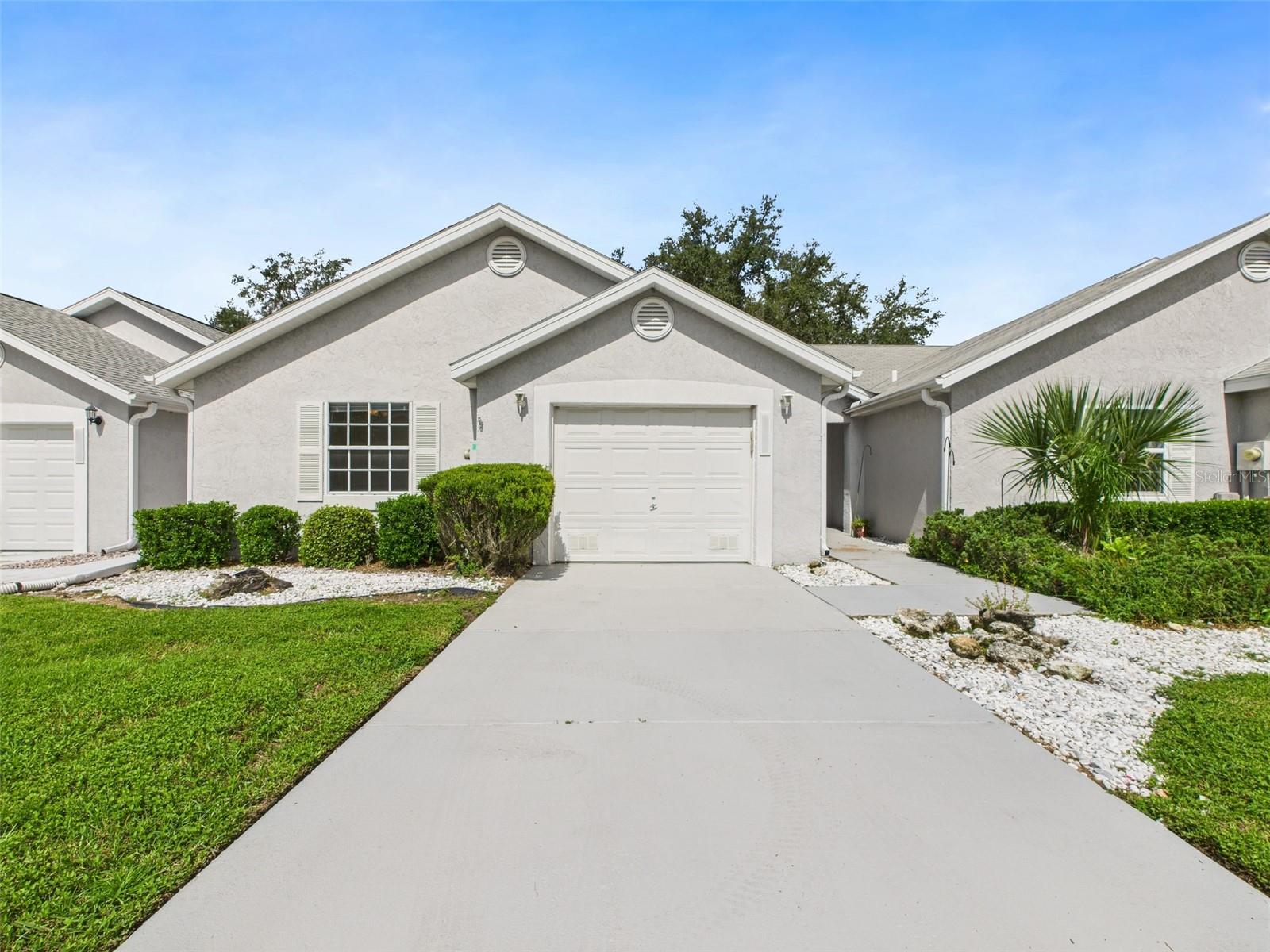 Welcome to Cala Hills – a charming and conveniently located neighborhood in the heart of Ocala! This delightful 3-bedroom, 2-bath villa/patio home offers low-maintenance living just minutes from retail shops, restaurants, and the Paddock Mall. Step inside to find ceramic tile flooring throughout the main living areas, soaring cathedral ceilings, an eat-in kitchen, and an inside laundry room complete with washer and dryer. Enjoy your mornings or evenings on the covered lanai, perfect for relaxing or entertaining. Recent updates include fresh interior paint, brand-new carpet, and a new roof installed in June 2025—giving you peace of mind and move-in-ready comfort. Cala Hills also offers wonderful community amenities such as a clubhouse, pool, library, billiards room, and fitness center. Don’t miss the opportunity to call this lovely villa your new home—schedule your private showing today!