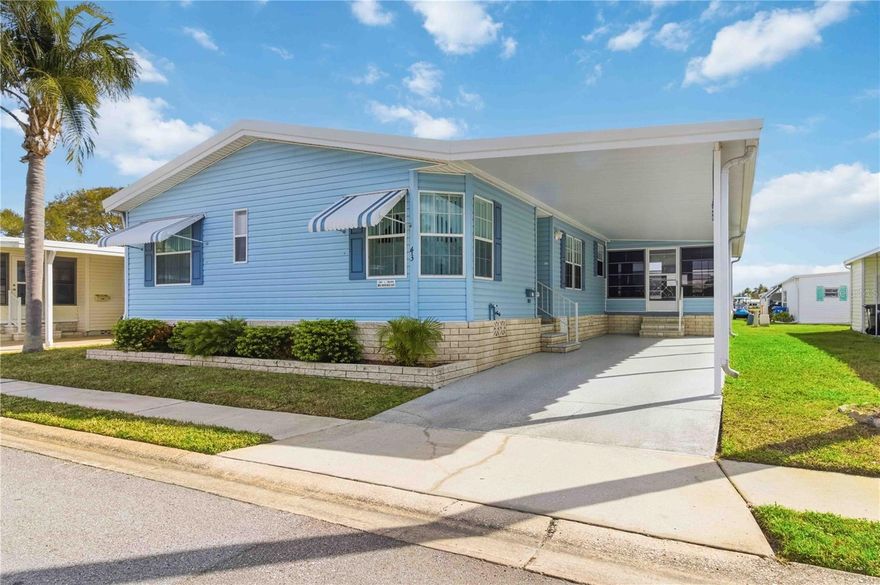 Like to play golf? Wouldn’t it be nice to live close to your golf course? This expansive mobile home is situated in Fairway Village, which has its own 9-hole golf course! The home has two bedrooms, 2 baths, a bonus room which is perfect as a sitting room or home office. There is a large living room dining room combination, high ceilings, screened-in patio, tool shed, and covered parking for two vehicles. 
As mobile homes go, this one is fairly new, having been built in 2001.  The owner has carefully maintained the property, and it is move-in ready. Bring your golf clubs, and start living the life you have always dreamed of!