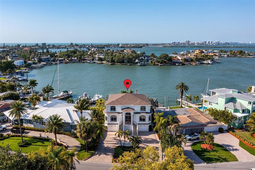 Experience the coastal elegance of this luxurious waterfront property. This stunning home, has been a popular short-term rental retreat and offers not just a residence but a gateway to the coveted beach lifestyle. 

As you approach the property, the sound of dolphins by the dock and the open views greet you. The home's exterior has been updated, featuring new roof, freshly painted façades, and professionally manicured landscaping. Step through the custom front door with etched glass detailing into a world where every day feels like a vacation.
The heated, saltwater pool area, invites you to relax and unwind under the warm Florida sun while enjoying views that stretch across the sparkling intercoastal waterway to the Belleair Beach Causeway and Sand Key of Clearwater Beach.

Enjoy the peace of mind knowing this home three-story haven is elevated and boasts seven bedrooms and six baths. Each bedroom serves as a private retreat, The interior brims with luxury, from the smart TVs and state-of-the-art home theatre with two rows of seating to the custom woodwork and high-end finishes throughout. 

The chef’s kitchen, with its gleaming quartz countertops and top-of-the-line appliances, is a culinary dream. Great for entertaining with large island in the kitchen and seating for 12 at custom table in kitchen overlooking pool and Inter-coastal.   Wall-to-wall windows/sliders and huge balcony off the living room.  Perfect for gatherings that spill out onto the balcony. The main living area features stunning electric fireplace and a grand entrance.

Main floor Master Suite with King bed, Ensuite bathroom, and private balcony overlooking heated saltwater pool and Inter-coastal views. Custom bunk bedroom with king/queen combo. Additional bedroom with 2 Queens on main floor with ensuite full bath.  Additional full bathroom and laundry room on the main floor. 

Master Bedroom on top floor with large balcony overlooking Inter-coastal with breathtaking views.  Huge walk-in closet, luxury ensuite with soaker tub and huge walk-in shower.  Three other bedrooms on top floor.  Private balconies overlooking pool and inter-coastal off 2 bedrooms. Imagine waking up to the sight of the intercoastal and gentle breezes, a daily luxury at this splendid home. 

The Lower level features large bar with fridge and  wet bar and game room.  Enjoy the Home theatre room with 2 levels of seating, led lighting and 85" TV.  You also get a Gym room with assorted equipment and adjoining bathroom with shower. 

Located near Tampa International Airport and St. Pete-Clearwater Intl Airport, ideally positioned for both travel and local exploration. The vibrant communities of Clearwater and St. Petersburg are mere miles away, offering endless dining, shopping, and cultural experiences.

 The lifestyle here is all about Florida living at it's best - soaking up the sun, whether it’s jet skiing, boating, or simply enjoying a sunset walk along the Gulf of Mexico. 

Strong rental income at over $346K in 2023 and over $220K for 2024. Already fully compliant with the new Indian Rocks Short-Term rental polices and procedures instituted last year.  Live here full time or rent and use it when you want. 

This not just a home; it’s a lifestyle choice for those who seek luxury, comfort, and the tranquil beauty of Florida’s Gulf Coast. Don't miss the opportunity to own this piece of paradise, where every day is a holiday and every window frames a stunning view.