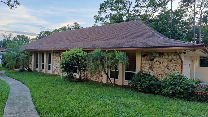 Charming 4 bedroom, 3 bathroom remodeled POOL home with a screened-in lanai in the lovely and tranquil - highly sought-after - Knollwood Community in Longwood, Florida; offers a unique combination of modern comforts, spacious living, and a prime location.  Enjoy easy access to all that Longwood and the surrounding areas have to offer, from top-notch schools to shopping, dining, and recreational opportunities. Spacious and completely remodeled yet retaining its classic charm and great curb appeal with a circular driveway providing abundant parking as well as a very large 23’X23’ side load double garage with a workshop, storage room, and room for all your toys as well as pull-down stairs to access the attic storage area.  Enter the home through the double front door with lovely stone accents outside and inside the entry.  The open concept formal living and dining great room flows into the kitchen/family great room.  Owner boasts over $80,000 in unique kitchen upgrades include a kitchen island and a separate breakfast bar with custom comfort high solid surface count tops, hardwood cabinets, lovely bright light fixtures and tile floor.  Ceiling fans with lights in all bedrooms add to your comfort and provide savings on your electric bill.  Sliding glass patio doors leading to the enclosed lanai can be left open to add heated living area to the house.  Must see to appreciate the picturesque screened in pool and the large private backyard enclosed on three sides by the neighbor’s fences.  This is a true Florida Paradise where you can relax and cool off in your large 32' X 17' in-ground pool with a bug free screen enclosure.  Enjoy the cozy wood burning fireplace to create a warm romantic feeling on chilly nights.  Plenty of elbow room with over ¾ acres of land so you can enjoy all the gardening and outdoor activities you want in your private back yard which is watered by a six-zone sprinkler system from your own deep well providing great savings on your city water bill.  Too many upgrades to list them all but to mention a few there is a new $45,000 high end walk-in tub with all the bells and whistles.  Upgraded comfort height dual vanity in the primary bathroom is accented with a unique stone wall and there is a large remodeled walk-in shower with decorative glass walls.  Some special home features that add value as well as energy savings include two AC systems, two water heaters, and a second roof over the original roof adds an extra layer of protection from possible hurricane damage. Make your appointment to see this lovely home in person today.