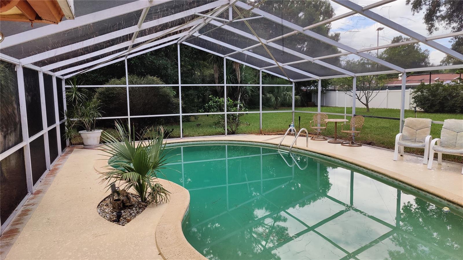 Charming 4 bedroom, 3 bathroom remodeled POOL home with a screened-in lanai in the lovely and tranquil - highly sought-after - Knollwood Community in Longwood, Florida; offers a unique combination of modern comforts, spacious living, and a prime location. Enjoy easy access to all that Longwood and the surrounding areas have to offer, from top-notch schools to shopping, dining, and recreational opportunities. Spacious and completely remodeled yet retaining its classic charm and great curb appeal with a circular driveway providing abundant parking as well as a very large 23’X23’ side load double garage with a workshop, storage room, and room for all your toys as well as pull-down stairs to access the attic storage area. Enter the home through the double front door with lovely stone accents outside and inside the entry. The open concept formal living and dining great room flows into the kitchen/family great room. Owner boasts over $80,000 in unique kitchen upgrades include a kitchen island and a separate breakfast bar with custom comfort high solid surface count tops, hardwood cabinets, lovely bright light fixtures and tile floor. Ceiling fans with lights in all bedrooms add to your comfort and provide savings on your electric bill. Sliding glass patio doors leading to the enclosed lanai can be left open to add heated living area to the house. Must see to appreciate the picturesque screened in pool and the large private backyard enclosed on three sides by the neighbor’s fences. This is a true Florida Paradise where you can relax and cool off in your large 32' X 17' in-ground pool with a bug free screen enclosure. Enjoy the cozy wood burning fireplace to create a warm romantic feeling on chilly nights. Plenty of elbow room with over ¾ acres of land so you can enjoy all the gardening and outdoor activities you want in your private back yard which is watered by a six-zone sprinkler system from your own deep well providing great savings on your city water bill. Too many upgrades to list them all but to mention a few there is a new $45,000 high end walk-in tub with all the bells and whistles. Upgraded comfort height dual vanity in the primary bathroom is accented with a unique stone wall and there is a large remodeled walk-in shower with decorative glass walls. Some special home features that add value as well as energy savings include two AC systems, two water heaters, and a second roof over the original roof adds an extra layer of protection from possible hurricane damage. Make your appointment to see this lovely home in person today.