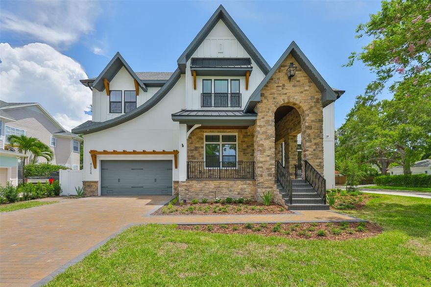 Move-in ready! Experience a remarkable lifestyle when you reside in this stunning new construction South Tampa pool home. Situated in the highly sought-after Mabry, Coleman, and Plant school district, this exclusive Reflection Custom Home property has 4,672 SF of interior living space featuring 5 bedrooms, 5 1/2 bathrooms, media room, study, 3 car tandem garage, elevator & whole home generator on a 75 x 120 lot. A luxury landscape package, dramatic sloped roof lines, and artful touches invite you to explore the comfort and luxury that await inside. The 2 story foyer leads through to entertaining-sized living rooms with views of the pool. The gourmet kitchen showcases modern style and comfort, with upscale Fisher & Paykel appliances, island seating, custom cabinetry, pantry prep room, and an open flow to the family room with custom wood beams and gas fireplace. The flexible 1st-floor layout features a study, guest suite with private bath, mudroom, and pool bath with space for a stackable washer/dryer complete the main level. The second level includes a lux primary suite with sound insulated walls, a spacious bathroom w/soaking tub, and a large custom closet plus the remaining 3 bedrooms, each w/custom baths & generous closets, a media room and a 2nd floor laundry room with dog wash station. The amazing rear property overlooking the pool and spa has a covered lanai with stained wood tongue & groove ceiling and a summer kitchen with 618SF of covered outdoor living space. Additional upgrades include: Elevator, whole home generator, impact windows, Moen Smart Leak Detection, in-wall pest tubes, Elan Smart Home System, smooth drywall, interior 8ft doors, crown molding, 25 Seer HVAC w/multi zoned control, Icynene R-21 spray foam insulation, speaker pre-wires, LED exterior holiday lighting, 2-10 Builder Warranty & so much more.