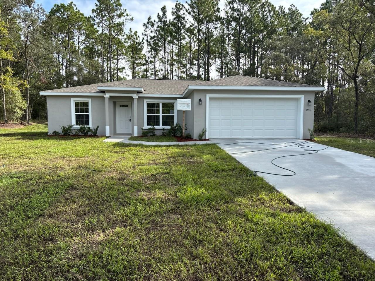 NEW CONSTRUCTION. MOVE-IN READY! This beautiful Key West Model offers 3 bedrooms, 2 bathrooms, and 1,405 square feet of thoughtfully designed living space. The master suite is the largest floor plan this builder offers, providing plenty of room to relax. Inside you will find a vaulted ceiling in the living room, luxury vinyl plank flooring throughout, and energy-efficient double-pane windows that fill the home with natural light. The kitchen stands out with stainless steel appliances, custom white shaker cabinets with soft-close drawers, granite countertops, a pantry, and a subway tile backsplash. Both bathrooms feature upgraded marble-look tile, with the master bath offering a glass-enclosed shower and the main bath featuring a tub and shower combo. A laundry room with an upgraded cabinet package adds extra convenience. The home is built with solid concrete block construction, topped with a 30-year architectural shingle roof, and is backed by a 10-year structural warranty. Outdoor living is easy with a covered patio and an attached 2-car garage complete with opener and remotes. With no HOA fees, you enjoy the freedom of ownership, and being located in flood zone X means this home is high and dry with no flood insurance required.