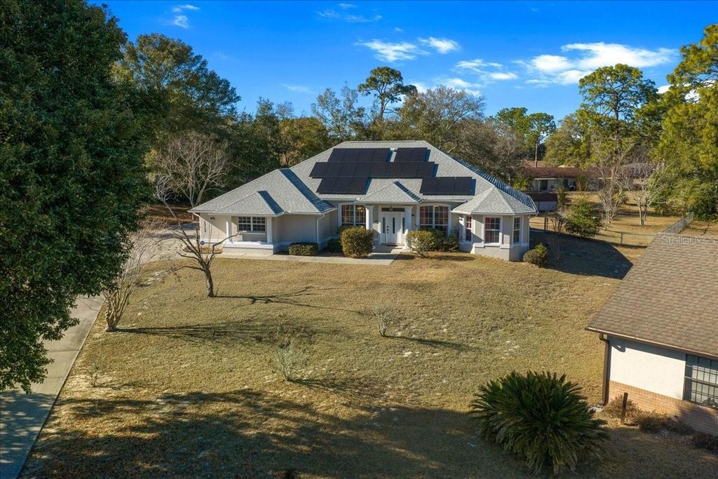 Photo of 10308 SW 83rd Terrace, Ocala, FL 34481 (MLS # OM718504)