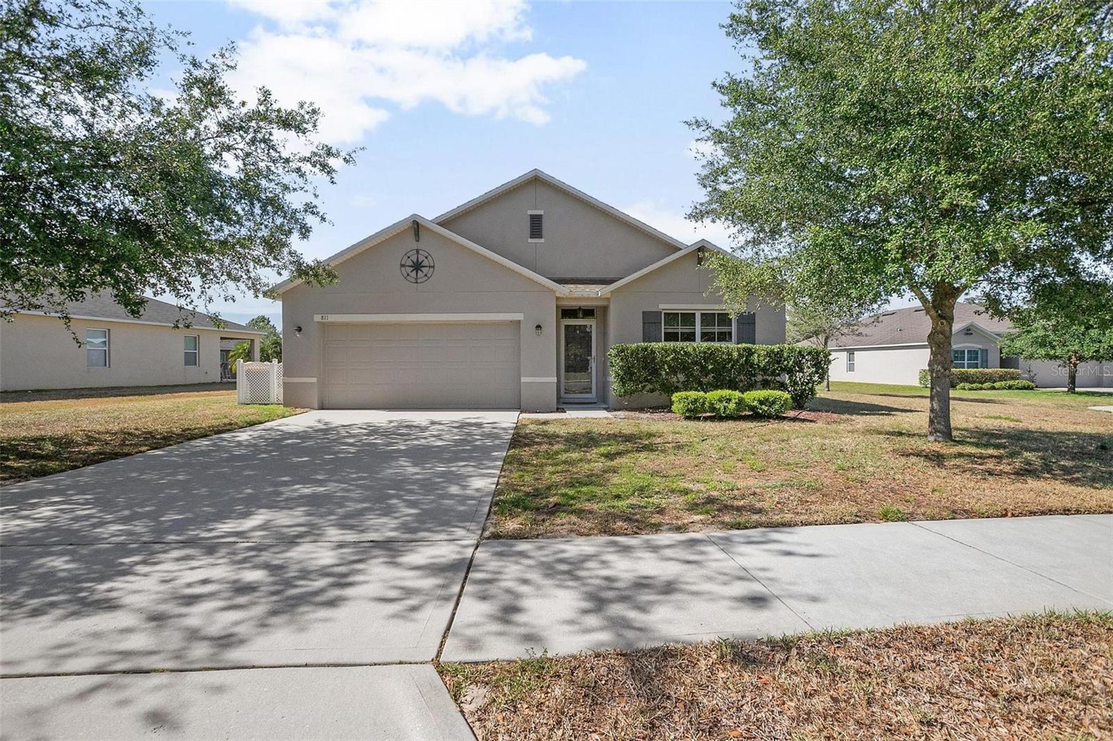 4 BED | 2 BATH | POND VIEW | CUL-DE-SAC LOT Welcome to this well-maintained home in Parkmore Manor, set on a quiet cul-de-sac with relaxing pond views. Just a few minutes from Downtown DeLand, the local YMCA, and DeLand High School this location keeps you close to everyday essentials while offering a peaceful neighborhood feel. The layout features an open living space, updated with new carpet and paint in early 2023, and connects seamlessly to the kitchen and dining area. The kitchen includes a large island, tile backsplash, pantry, and plenty of counter and cabinet space. Step out to the screened back patio, complete with a ceiling fan, wood accent wall, and a view that catches the sunset. The primary suite is privately positioned and features a walk-in closet, dual sinks, a walk-in shower, and separate linen and toilet areas. The three additional bedrooms are comfortably sized, each with ceiling fans, and the indoor laundry room adds extra convenience. Additional features include a water softener system and garage-mounted storage racks to keep things organized. The low monthly HOA fee covers high-speed internet, cable, and maintenance of common areas. You’re just a quick drive from shopping, dining, and more. Don’t miss your chance—schedule your showing today.