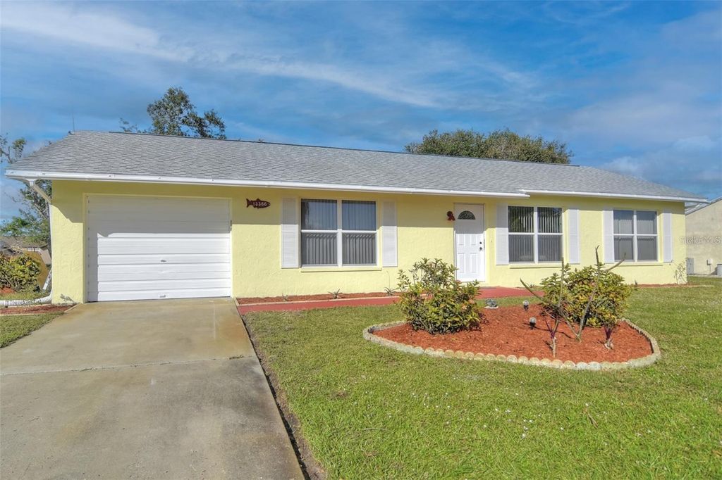 Photo of 13366 Bronze Avenue, Port Charlotte, FL 33981 (MLS # C7513947)