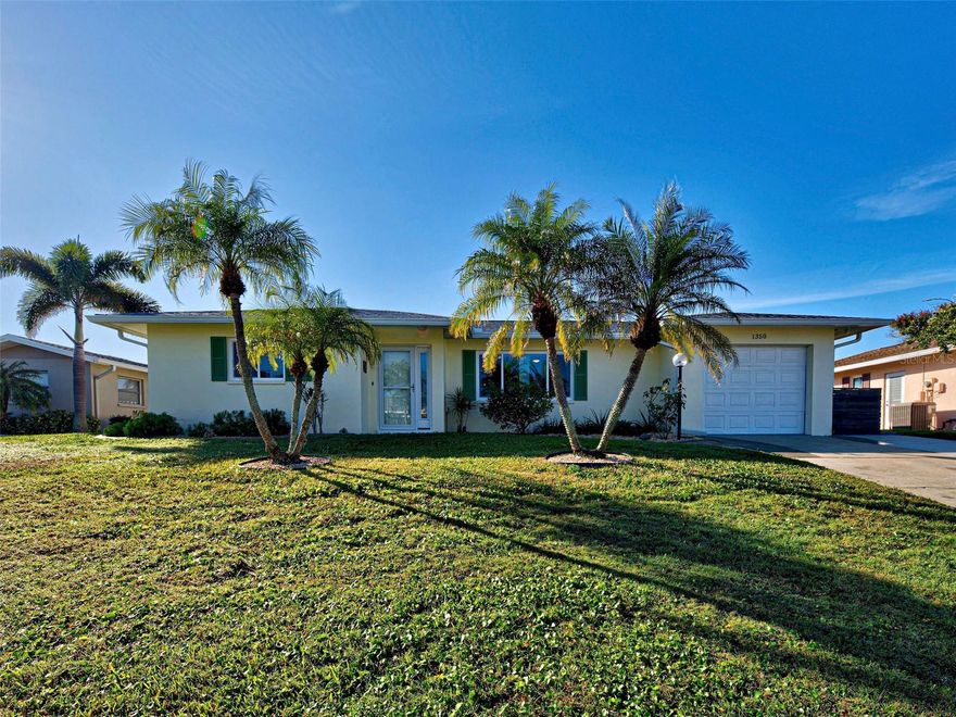 Welcome to 1350 Lakeside Drive, a beautifully situated home in the heart of Venice, Florida, offering the perfect blend of comfort, convenience and Florida Lifestyle! This inviting residence is nestled in a peaceful lakefront setting with scenic surroundings, yet remains just minutes from Venice's renowned beaches, charming historic downtown, shopping and fine dining and casual places to eat and entertainment! Inside you will find a bright and functional layout designed for easy living and entertaining. Spacious living areas flow effortlessly, complimented by abundant natural light and a seamless connection to the outdoors. The home offers generous sized bedrooms, ample storage and versatile spaces ideal for both full time living or seasonal enjoyment. Step outside to enjoy the tranquil outdoor areas, both screened or open patio, perfect for morning coffee, evening relaxation, water bird watching or hosting friends while soaking up the Florida Sunshine! Whether you are looking for a primary residence, vacation retreat or investment opportunity, this home offers exceptional value in a desirable location. Make Venice Gardens your new Home!

Important Facts: New Impact resistant windows and doors new in 2025, as well as the hot water heater and washer and dryer. New lanai awning 2025, New roof and gutters 2021, New electric panel in 2020, sewer pipe has been lined. Kitchen and baths are updated. Oversized garage has extra space for laundry and workshop/storage. outdoor shed is 8X10 feet in size. Venice gardens designated a bird sanctuary. Outdoor private shower. This property is in an X flood zone.
