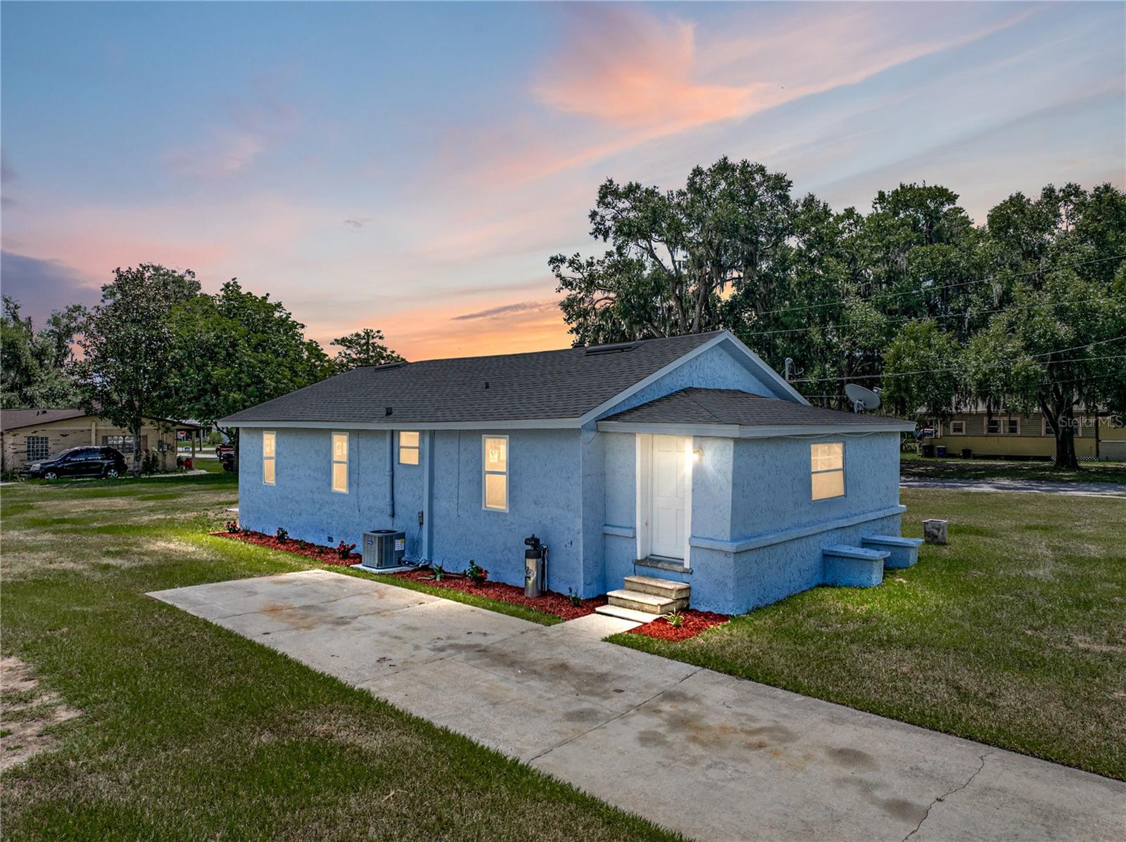 One or more photo(s) has been virtually staged. Welcome to this beautifully renovated three-bedroom, one-bathroom home in Bartow, FL, offering modern upgrades and comfort on a spacious corner lot. Thoughtfully updated from top to bottom, this home is the perfect choice for first-time buyers or those looking to downsize without compromising on style. Step inside to discover all-new luxury vinyl plank flooring throughout the main living spaces, paired with new carpet in the bedrooms for added comfort. The open and inviting floor plan makes the most of every square foot, creating a warm and welcoming environment. The fully updated kitchen is a standout, featuring stone countertops, all-new cabinetry, and stainless steel appliances—making meal prep both stylish and functional. Fresh interior paint enhances the home’s bright, clean feel, while the brand-new HVAC system provides year-round comfort and peace of mind. Set on a large corner lot, the property offers plenty of outdoor space with endless potential for gardening, play, or future expansion. Whether you’re searching for your very first home or seeking a manageable, updated home for a simpler lifestyle, this property checks all the boxes. Move-in ready and loaded with upgrades, this Bartow gem is ready to welcome its next owners.