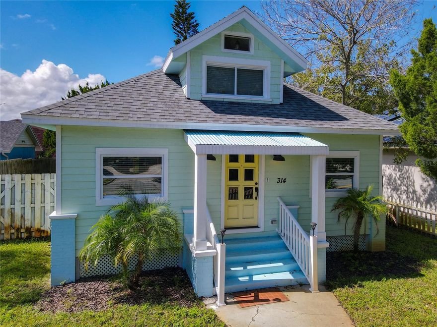 Opportunities abound with this furnished 2-bedroom, 2-bath historically registered home, ideally situated in New Smyrna Beach's highly desirable Canal Street area. This exceptional property boasts a detached garage/gameroom, a spacious fenced yard with a jacuzzi-style hot tub, fire pit, and more. Located within the short-term rental district, it's just three short blocks from the vibrant Canal Street restaurant and shopping district. Head east by car, and you'll be at the beach in mere minutes.  This beautifully remodeled home features a modern, updated kitchen with a breakfast bar, soft-close cabinets, granite countertops, and more. Enjoy hardwood floors, updated lighting, renovated bathrooms, and a tankless hot water heater. The cozy Florida room, dining room, and living room offer ample space, complemented by a charming doggie parlor. Nicely sized bedrooms on the main floor provide generous closet space, and an inside laundry closet adds convenience. The second level features a large loft with additional beds, easily transforming this into a 3-to-4-bedroom home that comfortably sleeps 8-10 people. The property includes a well-sized fenced yard and private rear access to the garage parking area. A true gem, this home offers close walking proximity to the popular Canal Street. Its zoning allows for multiple uses, including the possibility of converting the garage into additional living space. So many opportunities await, whether as a second home or a lucrative rental investment. This home truly must be seen to be appreciated.