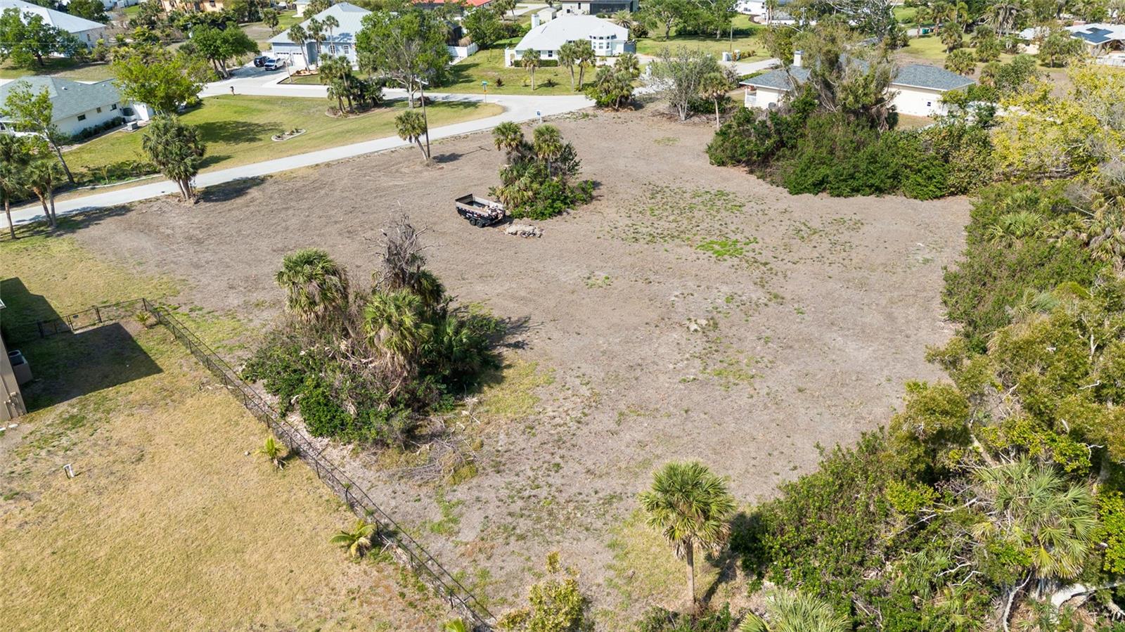Explore this spacious, cleared 0.66-acre lot ready for construction in the esteemed community of Cape Haze!! The neighborhood is adorned with Banyan tree-lined streets and notable million-dollar residences, making it a highly coveted area. Placida is renowned for its charming coastal lifestyle, with access to boating, incredible fishing, and many other outdoor adventures. Explore nearby historic Boca Grande, known for its quaint shops, dining, and stunning beaches. Enjoy optional HOA membership featuring social activities and exclusive access to a private beach and dock on Don Pedro Island. One of the few lots in this community that have public sewer hookup available.