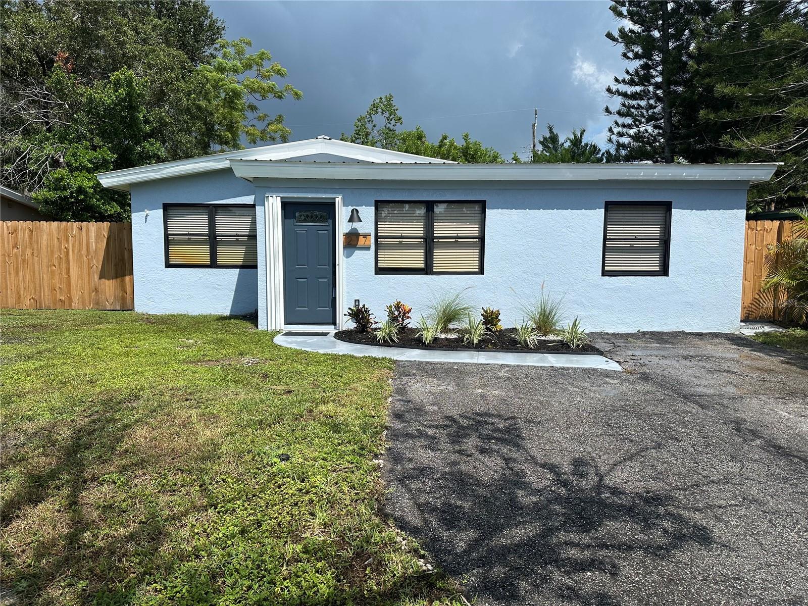 Look no further—this is the best home for you! Discover modern comfort in this beautifully renovated 3-bedroom, 2-bathroom home that has been professionally and meticulously prepared for its new owners to call home. This move-in ready gem showcases extensive updates throughout, including a brand-new electrical panel and HVAC system for peace of mind and efficiency. Don't be shy-the seller will do their absolute best to help new owners call this well-prepared property home, with reasonable requests for concessions considered. Fresh interior and exterior paint, stunning new LVP flooring, and stylish fixtures create a contemporary aesthetic that flows seamlessly from room to room. The heart of the home features a modern kitchen with custom cabinetry, all new Frigidaire appliances including refrigerator, 5-burner glass top range, dishwasher and microwave, elegant stone countertops, and a designer tile backsplash, with ample space for dining and entertaining. A high-efficiency washer and dryer combo adds convenience and efficiency to daily living. Retreat to the primary suite complete with a private en-suite bathroom featuring a sleek pedestal sink and spacious walk-in shower. The third bedroom offers convenient access through sliding doors, to the 8x15 back patio with sunshade, creating a seamless indoor-outdoor living experience. Outside, the fully fenced backyard and covered patio provide the perfect setting for outdoor relaxation and gatherings. Ideally positioned in a desirable location, you'll enjoy convenient access to dozens of nearby restaurants, Eagle Lake Park, Largo Central Park & Nature Preserve, vibrant downtown St. Petersburg, pristine Gulf Coast beaches, world-class entertainment, shopping, and dining—all just minutes from your front door. This exceptional home combines modern updates with an unbeatable location, making it a rare find in today's market. See it Today Before It's Too Late.