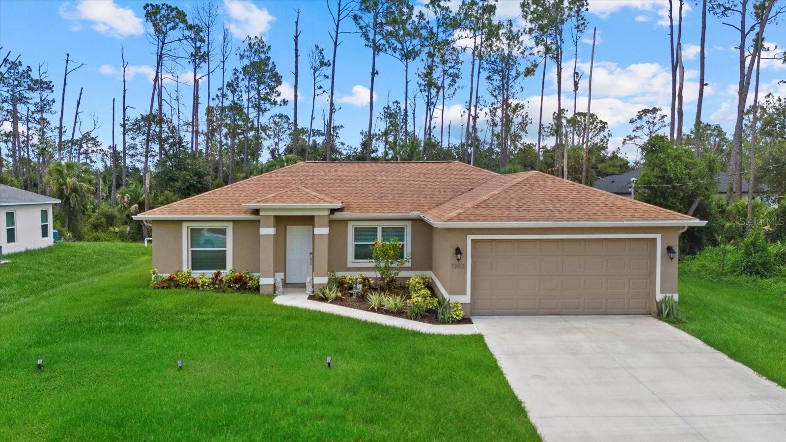 Built in 2022, this beautifully upgraded 3-bedroom, 2-bath home offers 1,427 sq ft of living space and 2,015 total sq ft, perfectly located in a quiet, desirable area of North Port.
From the moment you step inside, you'll appreciate the open, split-bedroom floor plan with soaring vaulted ceilings and sleek porcelain tile flooring throughout—no carpet to worry about! The spacious kitchen is designed for both style and function, featuring granite countertops, stainless steel appliances, soft-close full overlay cabinetry, and a breakfast bar that flows into the main living area.
Thoughtfully built with energy efficiency and low-maintenance living in mind, this home includes HURRICANE-IMPACT insulated windows, a 3-zone sprinkler system, and upgraded plumbing and electrical fixtures throughout. Granite window sills and designer lighting add subtle touches of luxury.
Enjoy your mornings or unwind in the evenings on the screened-in lanai overlooking a fully sodded and landscaped yard—ready for your personal touch. The attached 2-car garage and wide driveway offer plenty of parking and storage space.
Whether you’re a first-time homebuyer, downsizing, or looking for a well-built seasonal retreat, this home checks all the boxes with modern finishes and peace of mind.
No HOA, no CDD, and conveniently located near shopping, schools, restaurants, and North Port’s growing amenities. Don’t miss your chance to own this move-in ready gem!