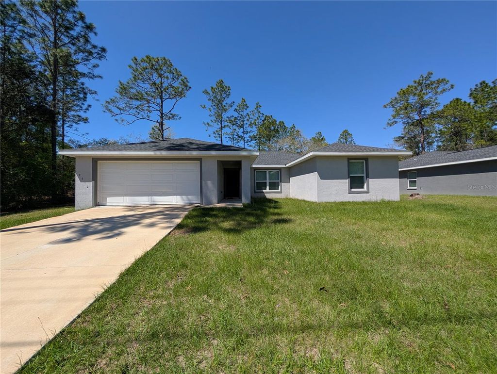 Photo of 9712 North Country Club Way, Citrus Springs, FL 34434 (MLS # W7884180)