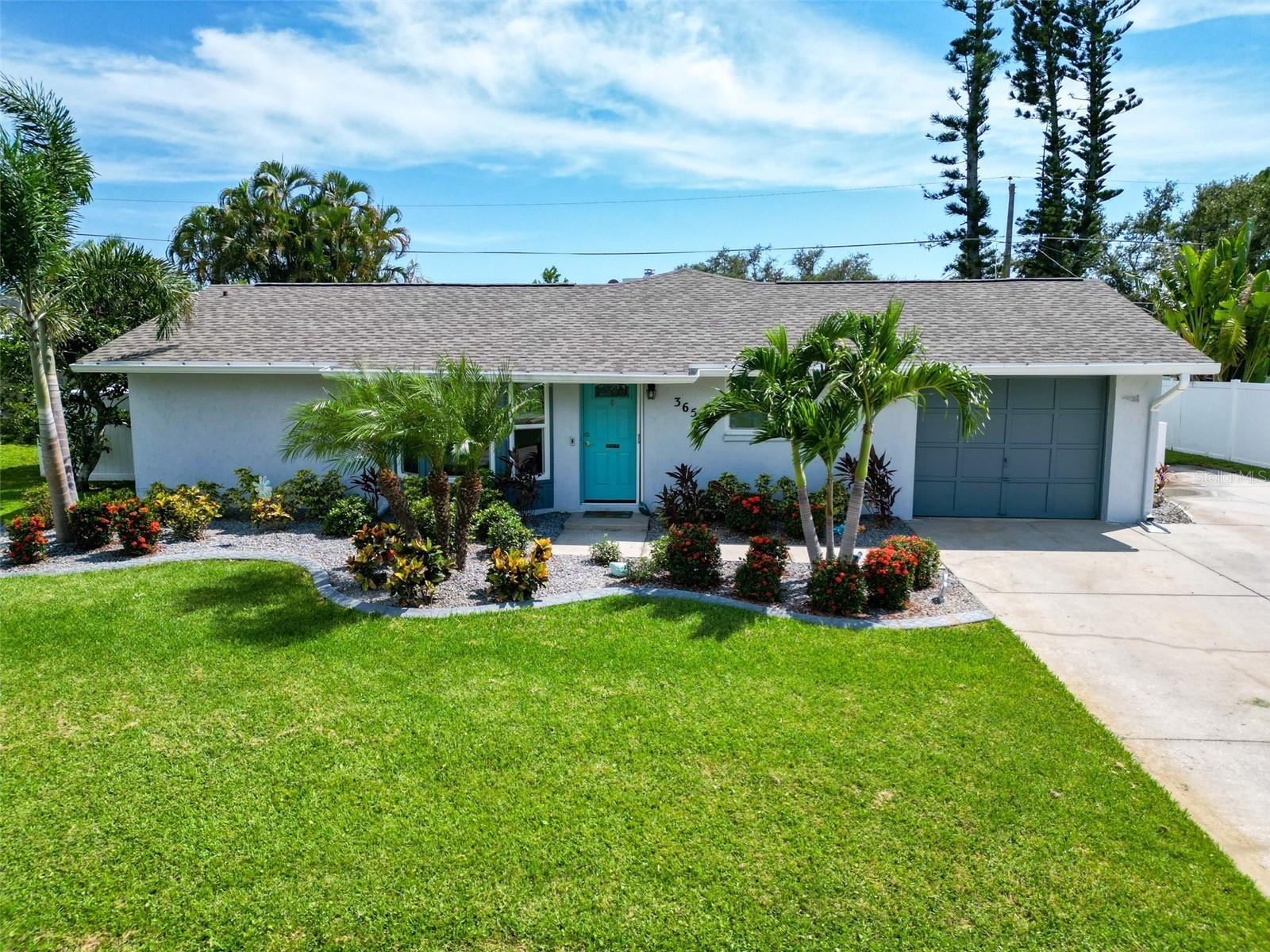 Discover your dream home just minutes from the stunning and pristine VENICE BEACH. This charming and inviting 3-bedroom, 2-bathroom house offers a perfect blend of comfort and convenience, spacious and thoughtfully designed. Did I mention this is a DOUBLE LOT! Enjoy the added benefits of a secure, ATTACHED GARAGE. A large, sunlit SCREENED IN LANAI for delightful outdoor dining and relaxation. Beautiful Tropical Landscaping. Wood Burning Fireplace for a cozy evening in. TONS of CLOSET SPACE with TWO WALK-IN CLOSETS, and an OVERSIZED PANTRY. QUARTZ countertops! NEW VINYL FULLY FENCED-IN yard providing both privacy and a safe haven. Recent upgrades include a BRAND NEW ROOF with the 3rd Nail Tie Down for INSURANCE DISCOUNTS! NEVER have to hang hurricane shutters again! Unlike most New Construction homes in the area that come equipped with only hurricane shutters, this property boasts premium HURRICANE IMPACT WINDOWS, providing superior protection/peace of mind during storm season and superior energy efficiency. As well as NEW BLINDS throughout the home. NEW HOT WATER HEATER and WATER SOFTENER. NEW Stainless Steel Appliances. NEW CUSTOM SHED. Septic was recently cleaned out! And did I mention the living room has a SKYLIGHT providing so much NATURAL LIGHT! NON FLOODZONE! The VENICE FERRY is around the corner for your personal shuttle to a PRIVATE ISLAND. As you see this Block home offers everything and more when compared to new construction so why wait? Don't miss the opportunity to experience the best of serene coastal living in this beautifully updated and well-maintained home. Schedule a viewing today!