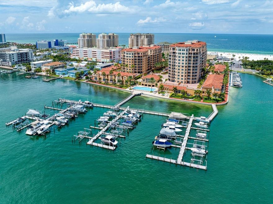 Discover the epitome of luxury living in this stunning 4,192 square foot penthouse exquisitely designed to embrace Florida’s sparkling Gulf Coast. Step inside the double entry doors into the spacious living and dining room where walls of windows and sliders flood the space with natural light and offer breathtaking panoramic views of Clearwater Beach and the Intracoastal Waterway and create a seamless transition to covered terraces where you can relax and enjoy the sea breeze as you soak in the unparalleled vistas that surround you and be mesmerized by the night lights dancing off the water. A bonus space adjacent to the living room would make a great library, home office, game or craft room. The attention to detail is evident throughout, with high-end fixtures, beautiful molding, and elegant travertine marble floors. In the magnificent kitchen, the views continue to captivate as you prepare culinary delights. Equipped with top-of-the-line stainless steel appliances, glistening stone countertops and a custom island it’s a chef’s dream come true. The luxurious primary bedroom is a haven of indulgence, complete with postcard perfect views and a wet bar for moments of relaxation. The ensuite bathroom is spacious and inviting, boasting a jetted tub for ultimate pampering and serenity. This exceptional penthouse is an oasis of elegance and refinement, offering a lifestyle that embraces beauty, tranquility and unparalleled comfort. Whether you desire a serene retreat or a space to entertain in grandeur, this home is a gem amidst the vibrant landscape of coastal living.  Amenities include 24-hour manned security, resort style pool and spa, fitness center, club room with billiards, outdoor grills, and plenty of room to enjoy the best the Florida has to offer.