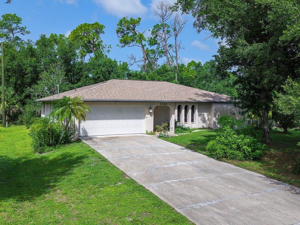 Photo of 1049 Fleetwood Drive NW, Port Charlotte, FL 33948 (MLS # N6144977)