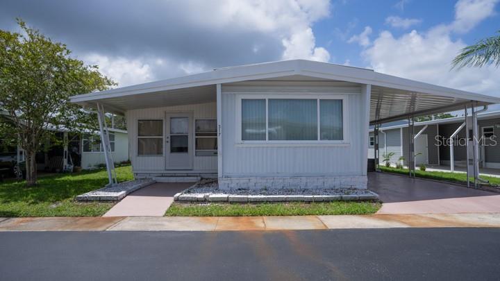 Set in Westwind—a resident-owned Dunedin community known for simplicity and value—this inviting 1-bed, 1-bath home pairs a bright, flexible layout with a turnkey beach-town lifestyle (furniture conveys as shown) and low carrying costs: the $150/month HOA fee covers ground/lawn maintenance, trash pickup, and full access to community amenities, including a year-round temperature-regulated pool, an active clubhouse with a calendar of events, and an updated outdoor recreation area. Inside, easy-care laminate flooring connects a comfortable living/dining area to a practical kitchen with matching appliances and abundant cabinetry; the large east-facing Florida sunroom—currently used as a second bedroom—welcomes morning light and doubles as guest space, office, or sunny lounge, while a spacious primary bedroom and a full bath with shower/tub combo and ceramic tile complete the plan. Minutes to shopping, dining, entertainment, and the sugar-sand beaches of Honeymoon Island, this Westwind home is ready to welcome you for the season or all year—with the comfort, convenience, and low-maintenance Florida living today’s buyers are searching for.