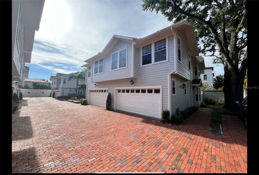 This beautiful three-bedroom townhome, in a small and quiet gated community, offers an attached two-car garage and is the only unit adjacent to the community's beautifully landscaped and maintained common area--so much natural light and amazing windows! Amenities also feature a pool, patio furniture, and a covered area for socializing. The first floor features an open concept floor plan, modern kitchen with a gas range, granite counters with bar-height seating, wood flooring, a remote controlled gas fireplace, updated half-bath, and a fenced-in deck perfect for grilling and socializing (with natural gas hook-up). Upstairs features an oversized primary bedroom which includes a large sitting area, walk-in closet, and ensuite master bath with a garden tub and separate vanities. The two other bedrooms are perfect for an in-home office, nursery, kids room, and/or guest room both with walk-in closets. Newly full-bath in the hallway! A full laundry closet is upstairs with a brand new washer and dryer. Many updates and improvements-flooring on stairs and upstairs hallway completely redone, to include fully remodeled full bathroom. Gorgeous plantation shutters and natural light downstairs and new blinds throughout. The community was just painted and the updated look is classic and beautiful! Great and convenient lifestyle! The townhome is zoned for Roosevelt, Coleman, and Plant, a short distance to Academy of Holy Names, and a short drive to some of the best private schools/preschools in South Tampa. It's is also very close to Pane Rustica, Osteria Natalina, Yoko's Sushi, and The Brunchery--all local favorites!