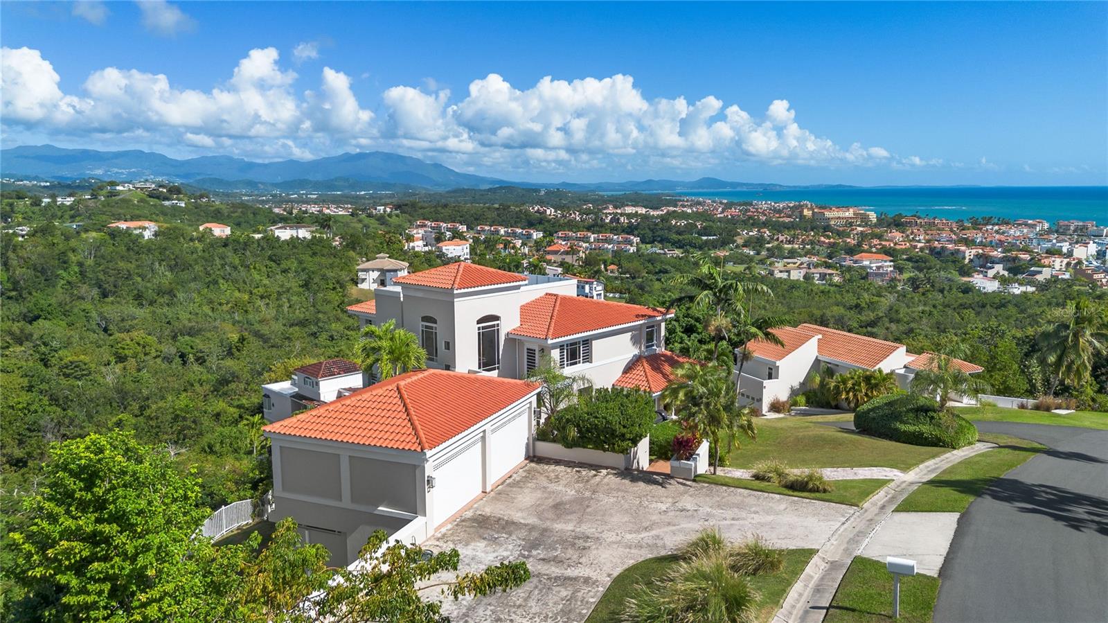 Welcome to Your Sanctuary in Palmas Del Mar
Experience luxury living where nature meets sophistication in this magnificent coastal home nestled within one of Puerto Rico’s most desired communities. Port Road #7 offers an unparalleled lifestyle with breathtaking panoramic views of the Caribbean Sea, the Island of Vieques, and the lush El Yunque tropical rainforest. Motivated Seller: 50k discount for a cash purchase to close within 25 days
Key Features:
- Unmatched Views: Wake up to jaw-dropping ocean and mountain views from every room, with the master bedroom and guest room offering particularly stunning vistas.
- Lush Garden Paradise: Enjoy an expansive, flattened lot perfect for gardening enthusiasts, featuring fruit-bearing trees such as bananas, avocados, mangoes, pomegranates, coconuts, moringa, and dragonfruit.
- Health and Wellness Retreat: Stay fit and rejuvenated with a private mini gym and a fully automated cold plunge designed for ultimate relaxation.
- Creative and Private Workspace: A detached office space offers a serene environment for work or creativity, doubling as a guest room with a pull-out couch.
- Safety and Modern Comfort: Hurricane doors and a fresh coat of paint (June 2024) enhance both security and elegance.
- Eco-Friendly Living: Solar water heater (installed within 15 months) and a monthly serviced generator ensure sustainability and preparedness.
- Chef’s Delight Kitchen: A beautifully designed kitchen featuring granite countertops, a massive Sub-Zero refrigerator/freezer, and an expansive island serves as the centerpiece of the main level.
- Practical Luxuries: Includes ample storage, a fenced backyard, a spacious two-car garage, and a welcoming driveway.
- HOA: $1,300/year
Elegant Interior Layout:
4 Bedrooms and 3.5 Bathrooms inside (plus an outdoor half bath).
Bright and airy living spaces with travertine floors, marble and granite countertops, and solid wood cabinets.
Two family rooms, dining room, and spacious living areas perfect for entertaining or relaxing.
Pre-approved buyers or cash buyers are invited to schedule a private showing to experience this rare coastal dream home firsthand.