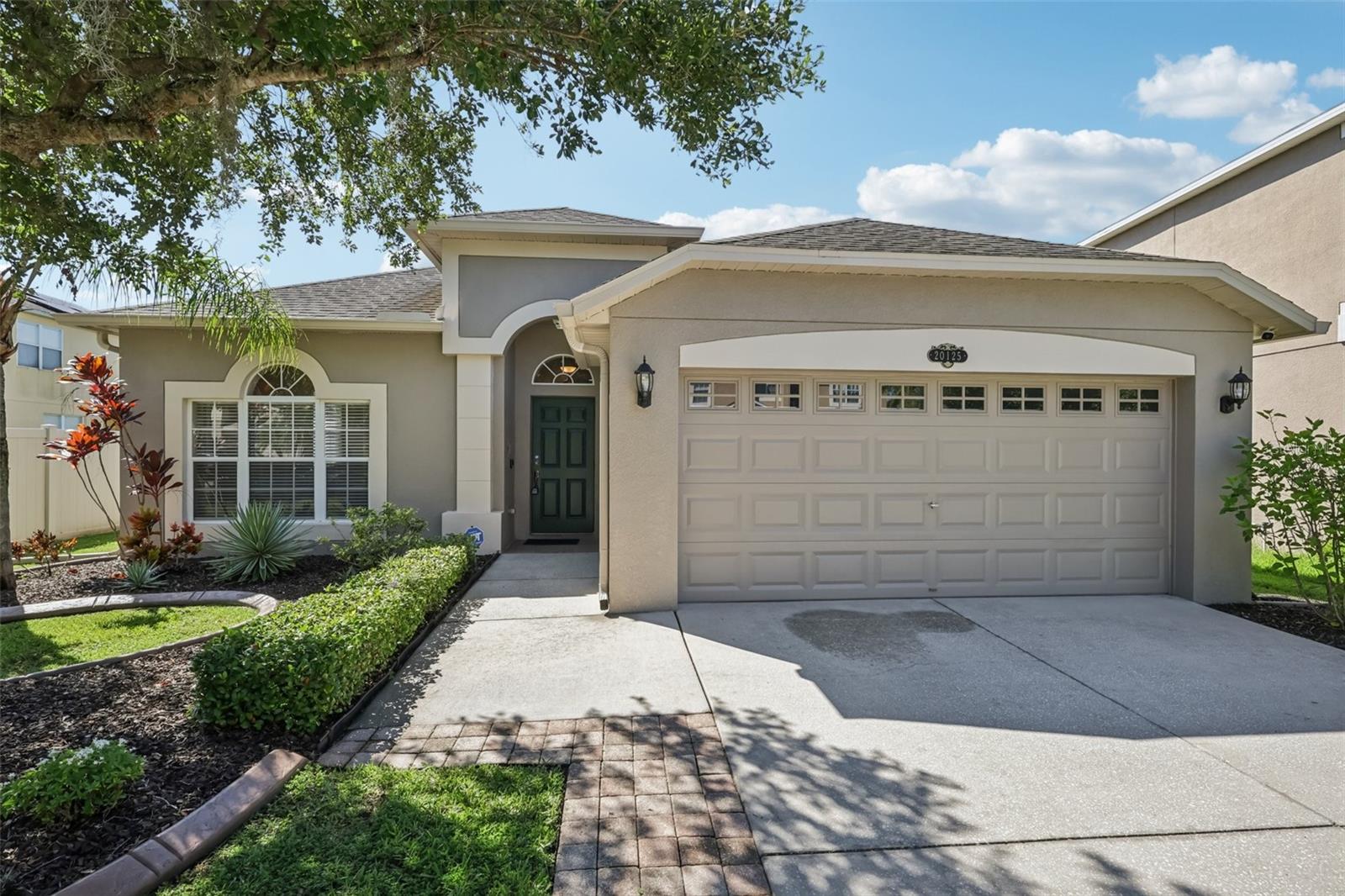 Welcome Home to 20125 Still Wind Dr, Tampa, FL 33647. Discover the perfect blend of comfort, style, and breathtaking views in this spacious 4-bedroom, 2-bathroom home offering 1,848 heated sqft. Step inside and enjoy the inviting open layout featuring plush carpet flooring paired with elegant ceramic tile accents. The heart of the home boasts solid wood cabinets and comes complete with all appliances included — truly move-in ready! Retreat to the generous primary suite featuring a walk-in closet, relaxing in-ground tub, and a large walk-in shower. Enjoy serene mornings on your screened porch with ceiling fan above, or entertain guests in your spacious backyard — perfect for kids, pets, and unforgettable community gatherings. Framed by a pristine white fence, the backyard offers stunning lake views that bring peace and beauty to your everyday life. Additional features include window treatments, an inside laundry room, and plenty of storage throughout. Don’t miss this rare opportunity to own a charming home in a desirable Tampa neighborhood — with space, scenery, and style all in one! Contact us today to schedule your private tour!