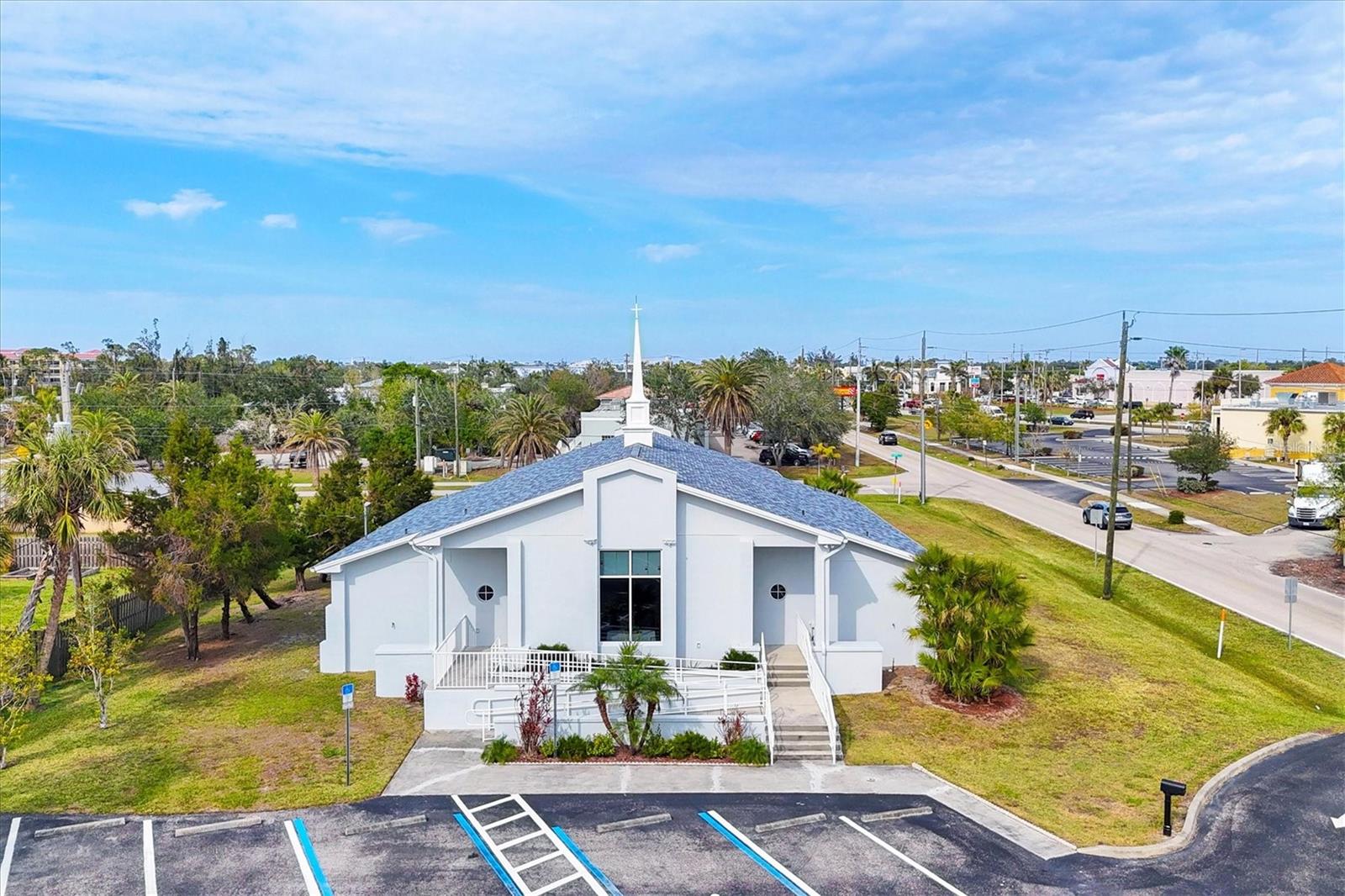 Welcome to this exceptional turn-key religious facility located at 2623 Vasco St. in Punta Gorda zoned RMF10. Built in 2007, this well-maintained building offers everything needed for immediate use. The property boasts a new roof installed in 2023, ensuring durability and peace of mind for years to come. The HVAC system includes two reliable Trane units to provide comfort throughout the year.
The property offers ample on-site 30+ parking spaces, as well as an additional triangle-shaped lot conveniently located across the street, perfect for accommodating overflow parking during large gatherings or events.
Whether you’re looking for a worship space or a multi-functional facility, this property is ready to meet your needs. Don’t miss the opportunity to acquire this exceptional property with everything in place to start serving your community immediately!