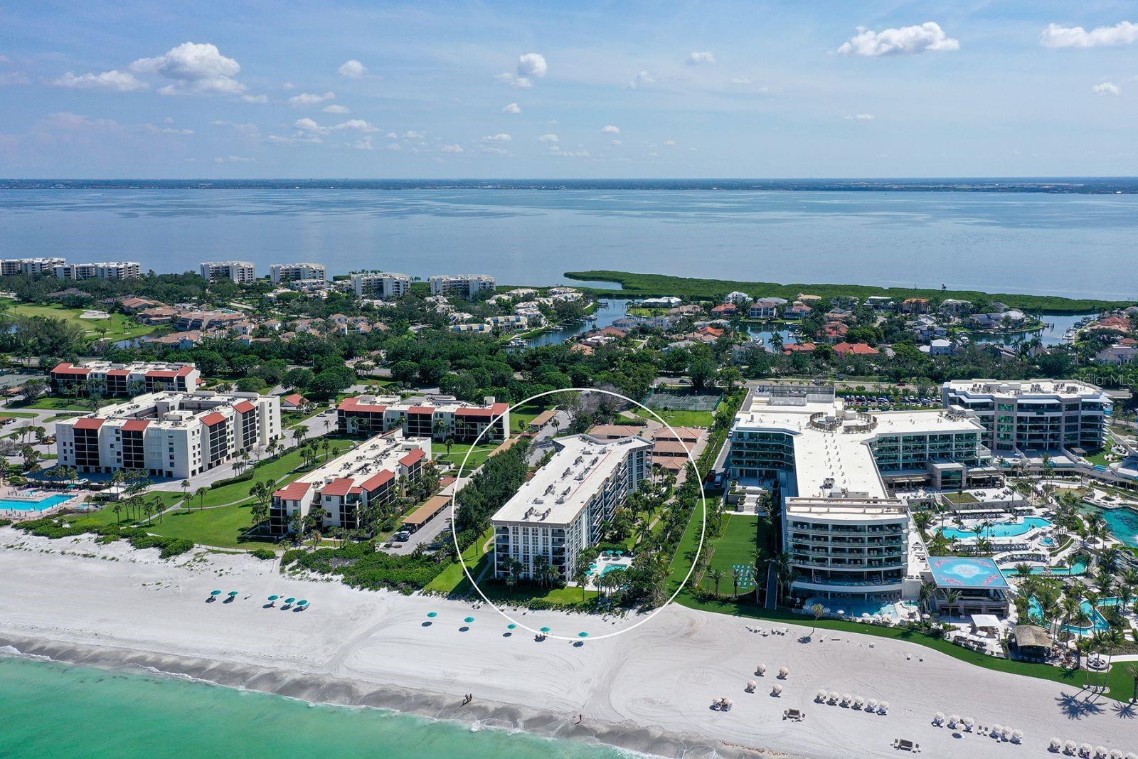 AQUARIUS CLUB – This exquisitely renovated fourth floor residence is situated within an exclusive beachfront boutique community on Longboat Key, located directly adjacent to the new Five Diamond St. Regis Resort. Modern design blends seamlessly with coastal elegance in the two-bedroom, two-bathroom retreat. The meticulously updated interior offers 1,551 Sq. ft of open living space, with privacy in a split bedroom floor plan. A generous balcony unveils views of the Gulf with floor-to-ceiling windows and sliding glass doors that lend brightness to the space, creating an airy atmosphere that feels both expansive and welcoming throughout. The kitchen is open to the living area, with details such as beautiful quartz countertops, an expansive island with dramatic quartz waterfall edge, recessed lighting, open shelving and modern cabinetry that blends sleek white finishes with natural wood. The state-of-the-art Café appliances are matte white and Wi-Fi enabled including a French door refrigerator and electric range (with glass cooktop and double convection ovens), plus an undermount single basin stainless steel kitchen sink by Moen. The epitome of luxury and comfort, the spacious primary bedroom includes plantation shutters and a private ensuite bath that features an open, integrated closet providing a cohesive dressing and bathing area with tub. The additional bedroom is stylish and functional, with new carpet, floor-to ceiling windows with plantation shutters, and a custom closet. The lobby and community rooms have been beautifully updated and with just 58 residences, Aquarius Club offers a beachfront resort living experience that caters to those seeking a higher quality of life in a more intimate setting. Enjoy an amenity-rich lifestyle beachside with a heated pool, beach umbrellas, barbecue grill, fitness center, hospitality room with catering kitchen, library and game room, tennis and pickle ball courts, onsite management, and maintenance supervisor. A highlight of ownership at Aquarius Club is the “complimentary” social membership included for the new St. Regis Resort, located next door. Adding to the convenience and enjoyment of your beachfront retreat at Aquarius Club, the St. Regis membership offers discerning dining opportunities, preferred pricing on Spa services, use of resort pool and winding river, state-of-the-art fitness center and more. Embrace the unparalleled sophistication and charm of the Longboat Key lifestyle.