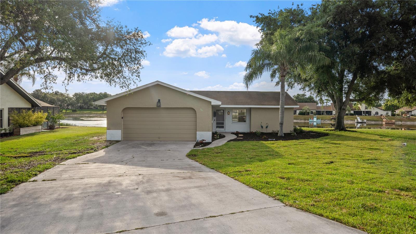 Welcome to Your Waterfront Paradise in The Heather! This beautifully renovated 3-bedroom, 2-bathroom home offers modern comfort in one of Weeki Wachee’s most desirable communities. Nestled in The Heather, enjoy access to a semi-private golf club and a variety of family-friendly activities—all surrounded by Florida’s natural charm. Step inside to discover a spacious open-concept layout, perfect for relaxing or entertaining. The primary suite is generously sized to fit a king bed with ease and features a spa-inspired ensuite bathroom, complete with three luxury shower heads for a truly indulgent experience. Enjoy peaceful waterfront views from your enclosed lanai, ideal for morning coffee or evening gatherings. The home also includes a large garage and an in-unit washer and dryer for everyday convenience. Located just 5 minutes from the world-famous Weeki Wachee Mermaids and minutes from springs, parks, and golf courses, this home is the perfect blend of adventure and tranquility. Whether you're a first-time buyer, seasoned investor, or looking for a vacation getaway, this property is rental-ready from day one, with a fully operational rental system already in place. With a low entry price, high ROI potential, and endless charm, this is your chance to own a slice of Weeki Wachee waterfront living. Don’t miss out—paradise is calling.