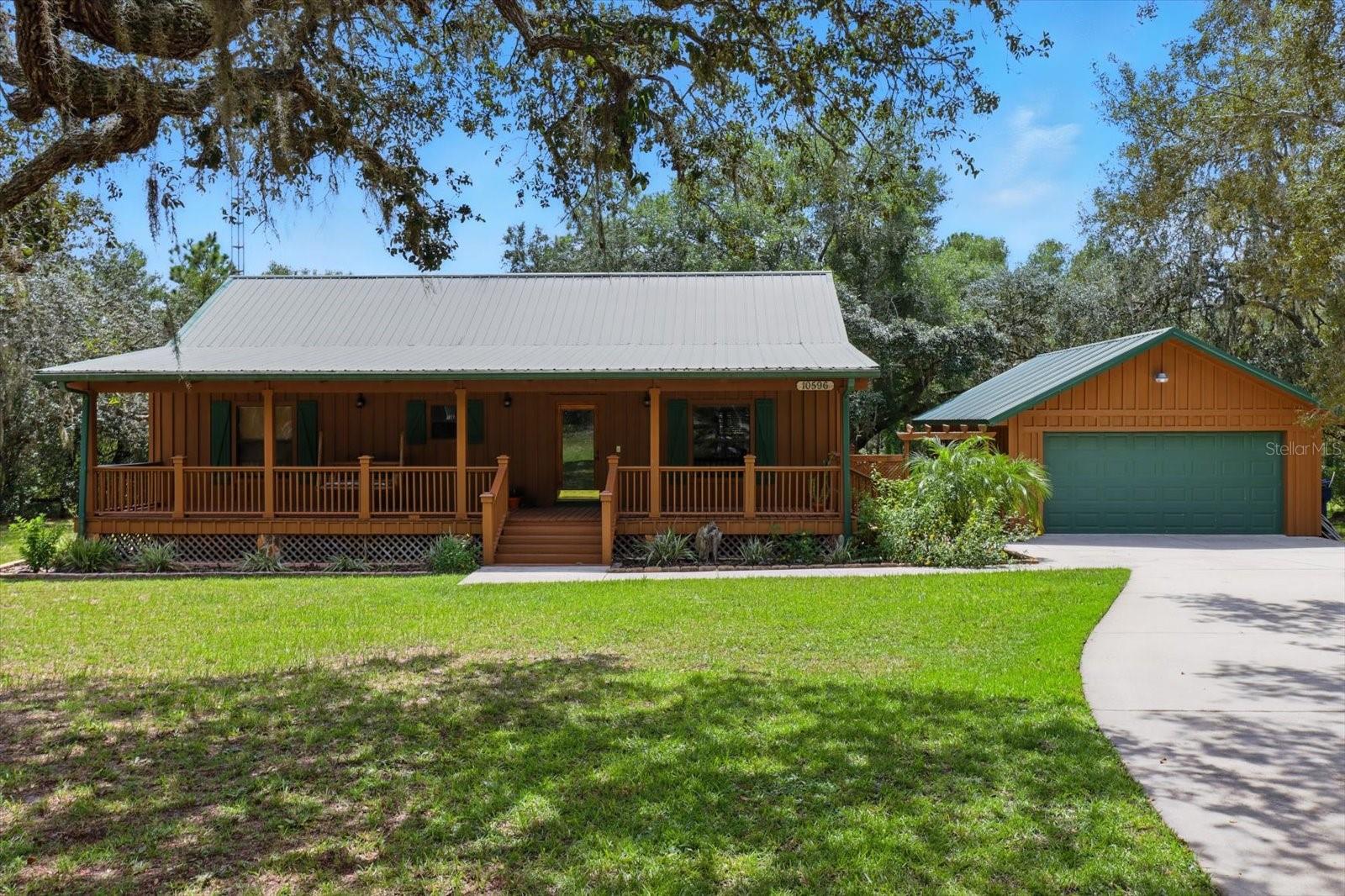 Imagine sipping coffee on the front porch swing, listening to the breeze through the trees, and feeling the quiet peace of your very own log cabin retreat. Nestled on over an acre at the corner of a private road, this home offers the perfect blend of rustic charm and modern comfort.
Inside, you’ll be welcomed by the warmth of all-wood floors and custom cabinetry, paired beautifully with granite countertops that make the kitchen both inviting and functional. With 2 cozy bedrooms and 3 full baths, there’s room for family, guests, or simply space to unwind.
The detached garage is a dream for hobbyists, storage, or anyone needing extra room to spread out. But it’s the atmosphere that makes this home special—every detail, from the natural finishes to the wraparound serenity outside, invites you to slow down and savor the lifestyle you’ve been dreaming of.
Whether it’s a weekend escape or your forever home, this log cabin sanctuary offers the peace, privacy, and character that’s hard to find.