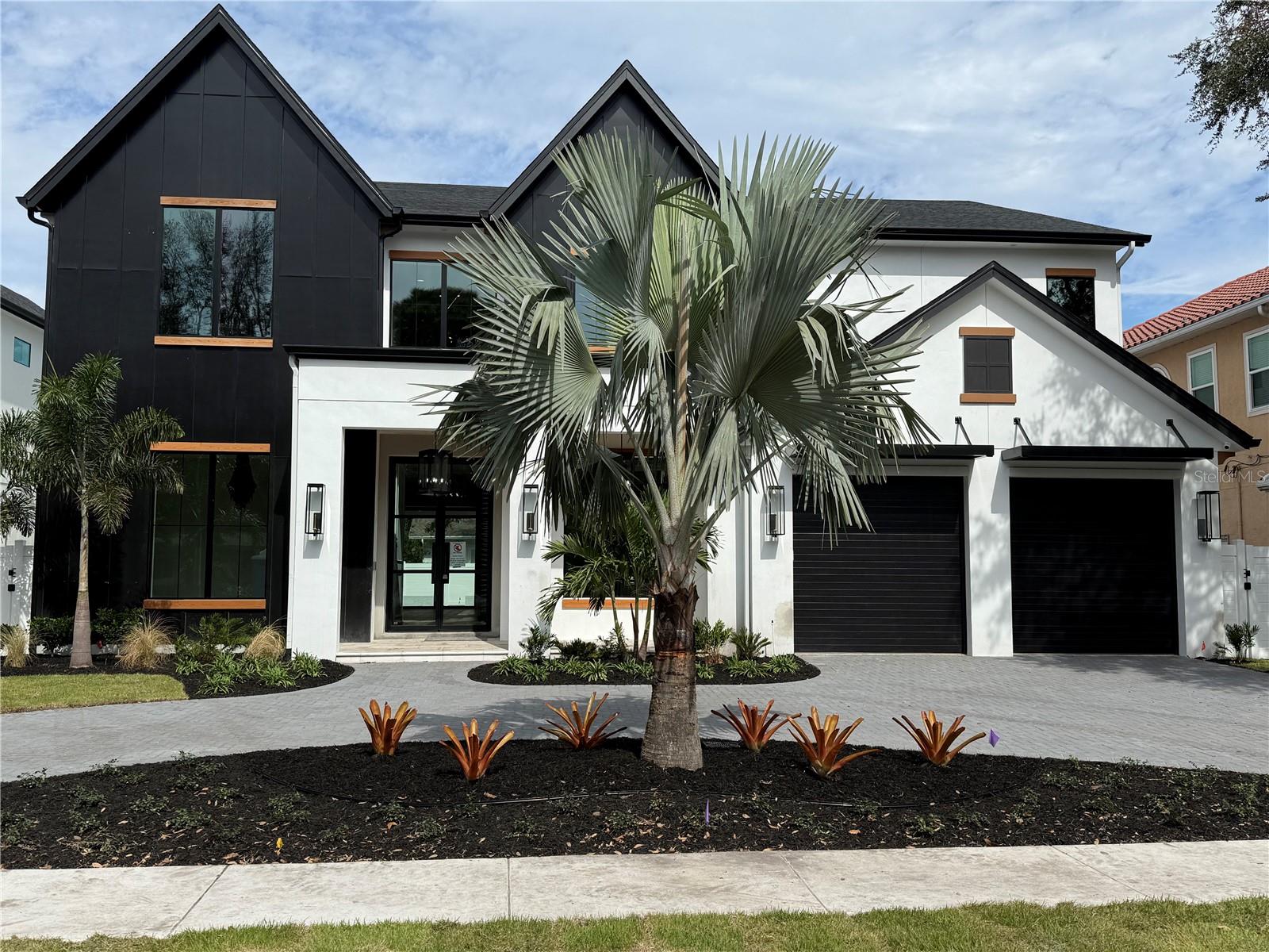 Pre-Construction. To be built. Welcome to the "Oak Hall" model by Luxury Home Builder, Taralon Homes! This custom home will sit on a beautiful tree lined street in sought after Bayshore Beautiful. The home has 5,464 sf of living space which includes 5 ensuite bedrooms (one guest suite located on the first floor), 2 additional half baths, an office, both a downstairs bonus/flex room and an upstairs game room, an oversized 2 1/2 car garage plus, a beautiful, heated pool with spa. There are custom luxury finishes throughout the home including a mahogany wood and iron front door, 2 story open foyer, stairway with oak treads and contemporary wood-stained handrails, 7 1/2 inch plank oak wood flooring, porcelain tile throughout the wet areas, crown molding, 8 foot interior doors and soaring 11.4 foot ceilings on the first floor with 10 foot on the 2nd floor, custom built closets, gas fireplace, upgraded spray foam in the attic +++ so much more! The kitchen features your choice of stained or painted wood cabinetry, 42” upper cabinets with light rails, your choice of granite or quartz with island to have waterfall edge countertop, tile backsplash, built in full size Thermador refrigerator and full size Thermador freezer, 48 inch Thermador gas range with griddle and a custom 52 inch range hood, and wine chiller. There is both a walk-in pantry and butler’s pantry adjoining the formal dining room with tiered ceiling. Situated off the kitchen and grand living room is the large, covered lanai with tongue and groove painted ceiling, built in outdoor kitchen with gas grill all overlooking the gorgeous pool and spa and finished off with silver travertine pavers. MAKE YOUR CUSTOM SELECTIONS NOW to add your own personal touch! Brochure with the floorplan and detail of the finishes is available.