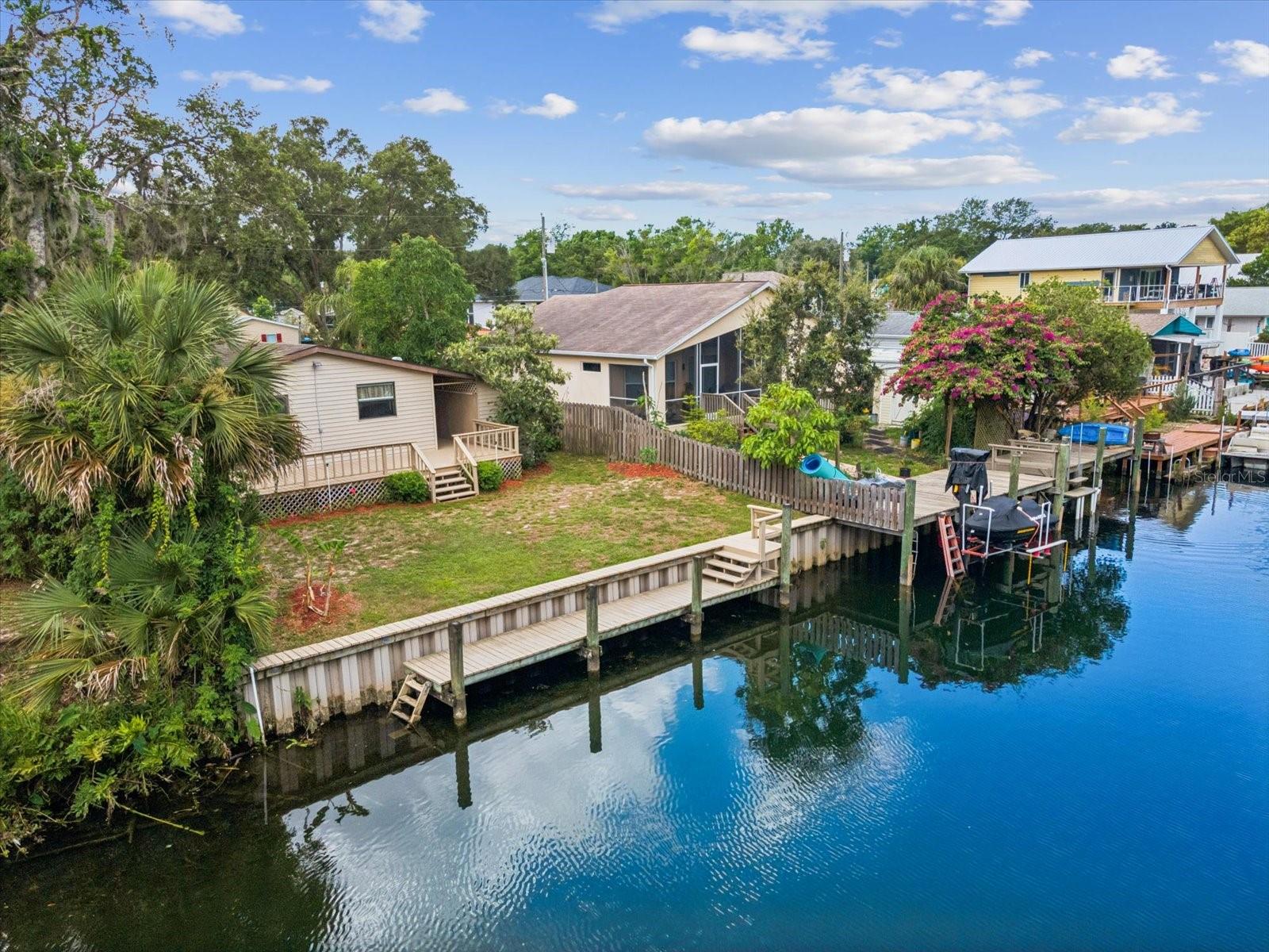 Come Live the ''Old-Florida'' River Lifestyle! UNTOUCHED BY FLOODING & Tucked Away on a Quiet Deep-Water Canal just Minutes to the Pristine, Crystal Clear Waters of the Weeki Wachee River & Direct Access to the Gulf of Mexico. Remaining High & Dry during recent storms, This FULLY FURNISHED (Furnishing Accommodate 6-8 People) 2 Bedroom, 2 Bath Home w/Carport & Storage Shed is the Perfect Riverfront Dream Home, Vacation Home or Rental Property - NO RESTRICTIONS for SHORT TERM RENTALS. New LVP Flooring Throughout. Roof 2017. Plenty of Space for Outdoor Entertaining on the Rear Deck & Private Yard Overlooking the Water - 50' of Walking Seawall w/Stairway to the Dock & Canal. Enjoy Fishing, Kayaking/Boating & Wildlife in your own backyard - Manatee & Porpoise are known to make Frequent Appearances.. Waterfront Dining/Entertainment, Shopping, Bayport Pier, Public Boat Ramps, Marinas, Waterfront Parks, The World Famous Weeki Wachee Springs Mermaids w/Buccaneer Bay Water Park, Hiking Trails, Golfing and More are all a Short Distance Away. Whether a Forever Home or Investment Home, Don't Miss Out - Call for Your Private Showing Today!