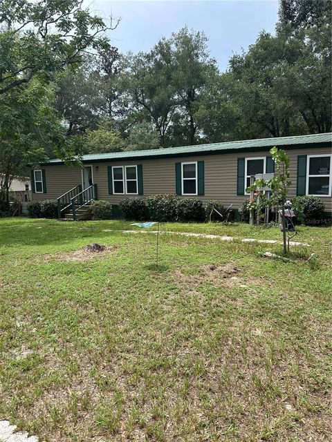 Photo of 570 NE 70th Terrace, Ocala, FL 34470 (MLS # OM721330)