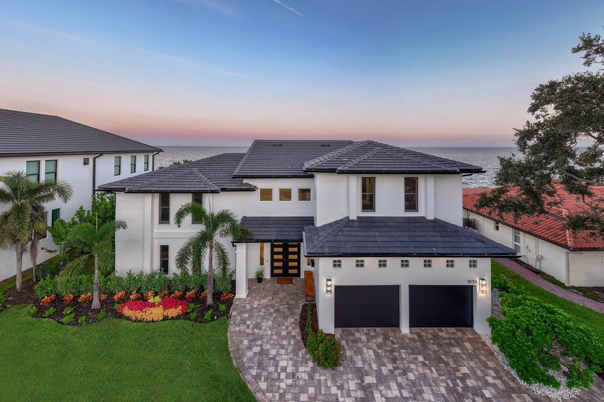 Exquisite Move-In-Ready Waterfront Masterpiece! Elevated and no flooding in recent storms, this house redefines St. Petersburg waterfront luxury. This contemporary gem blends bold architectural design with refined, inviting interiors, showcasing 90ft of panoramic open-water views. Features 4 upstairs bedrooms, including a luxurious primary suite with unrivaled water vistas, plus 2 first-floor bedrooms (one perfect as a guest or secondary primary suite). The outdoor haven boasts a brand-new 2025 dock, refreshed pool and decking, new 2025 outdoor grill, updated seawall, new 2025 slate roof, gutters, and soffits, and meticulously curated landscaping. Inside, expansive windows flood open-concept spaces with natural light, highlighting sleek contemporary finishes and effortless indoor-outdoor flow. Equipped with dual 2020 Trane HVAC systems and two 2017 tankless water heaters for ultimate efficiency. Just minutes from vibrant downtown St. Petersburg, this home epitomizes sophisticated St. Pete waterfront living. Ready for you to move in and enjoy the Florida lifestyle!