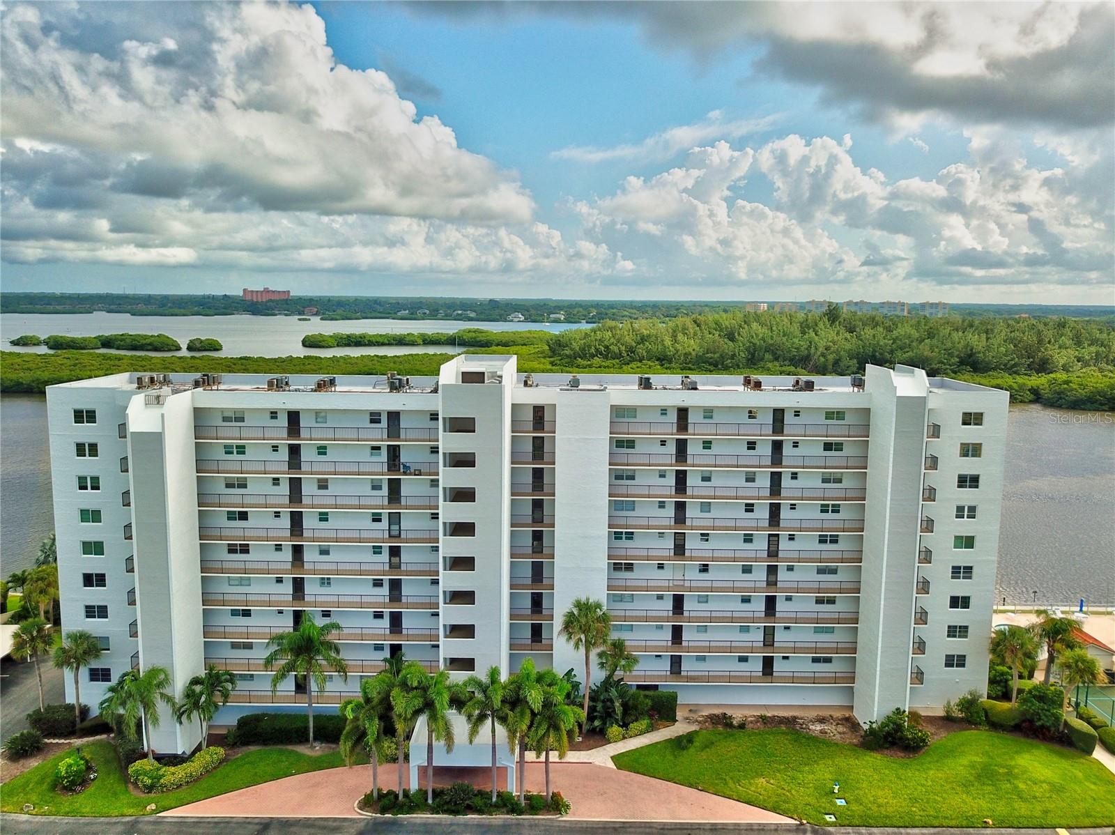 WATERFRONT. VIEWS!!! ** I challenge you to find better views (from EVERY window) anywhere on Siesta Key! Breathtaking WATER & NATURE VIEWS of the Gulf of Mexico, Little Sarasota Bay and the Jim Neville Nature Preserve from this 1630 square foot end-unit PENTHOUSE located on sought-after Siesta Key at the private and gated waterfront community ~ The Pointe ~ quietly tucked away at the end of the Key! The amenities are plentiful: boat docks, tennis and pickleball court, heated lap pool, spa, fitness rooms, gathering rooms for residents, kayak storage and launch, fishing, walking trail around property, cottage/club house with full kitchen and more! *** This prominent 10th-floor south building two-bedroom two-bathroom condominium features a primary bedroom which accommodates a king-size bed, en suite bath and walk-in closet. Sip tea or coffee watching the sunrise sparkle over the bay right from bed or while relaxing on the expansive lanai overlooking the nature preserve and waterway. The warm gulf and bay breezes are luxurious! Both the primary and second/guest bedrooms provide access to the lanai. The living and dining area opens to the spacious enclosed lanai which provides tranquil and remarkable views of the water, nature preserve and is perfect for viewing dolphins, manatees, kayakers, birds, boaters, and the beautiful outdoors! You may want to spend a little extra time in the kitchen with your Sub-zero refrigerator, stainless appliances, extra cabinet storage and counter space, plus there is room for a table allowing magnificent water and sunset views over the Gulf of Mexico. And, most convenient, and not often found in a condominium, is the separate laundry room located within the unit housing a washer and dryer, sink, HVAC unit with UV air purifier, and extra storage! Some of the furniture is included. A bonus is the deeded and covered parking conveniently located under the building on the ground floor with lobby access. No walking in the rain! We can all use extra storage - the deeded personal storage space on the ground floor level is great for beach chairs, golf clubs, extra supplies, etc. You will love the additional space! ** Experience island living at its best while residing in this top-floor unit with amazing sunrise and sunset views! Location. Location. Location. *** THE POINTE is a gated PET-FRIENDLY community that encompasses 5+ acres on the southern tip of world-famous Siesta Key. Features: Outdoor, fresh-air walkways to each unit. Boat docks w/electricity and water. Kayak/canoe/SUP launches. Heated outdoor lap pool at waterside. Spa. Tennis and pickleball courts. Dog walk. Open-air gazebo w/BBQ grills. Club house. Separate gathering rooms. A fitness center in each building. Full-time on-site manager. The Milestone I and II Inspection Reports, and the Structural Integrity Reserve Study (SIRS) completed. Surrounded by water on three sides, THE POINTE has easy access for boating and kayaking and is CONVENIENTLY LOCATED. You can find grocery, dining - fine and casual, shopping, Turtle Beach, Siesta Key Beach, a full-service marina, coffee shops, a campground (right on the beach), nightlife, entertainment, public transportation and more - all on Siesta Key.
