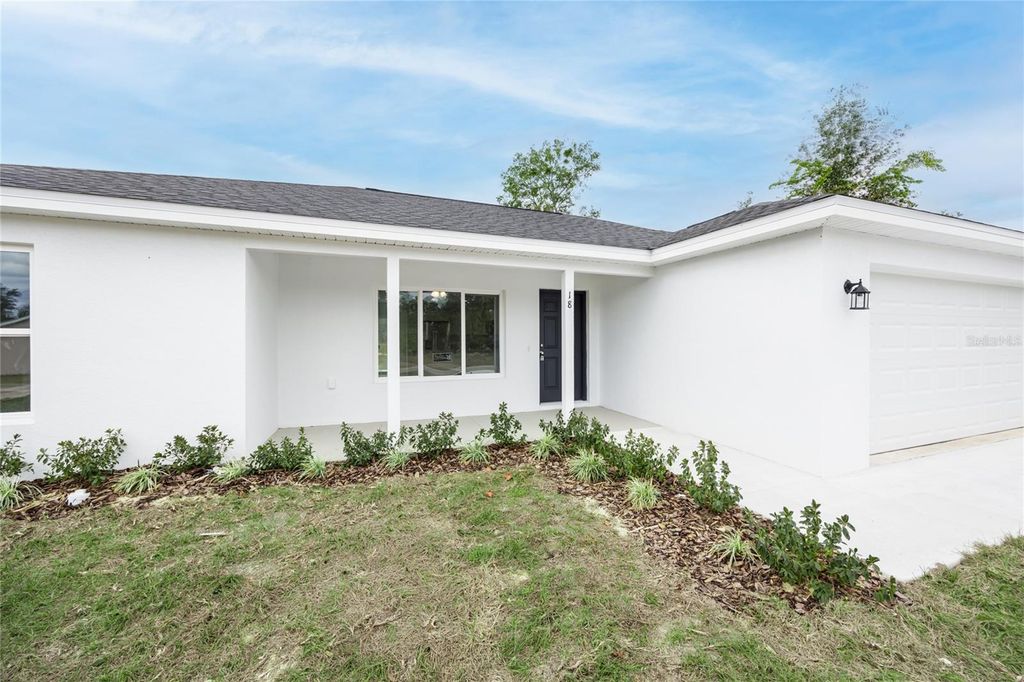 Photo of 18 Malauka Loop Pass, Ocklawaha, FL 32179 (MLS # GC529532)