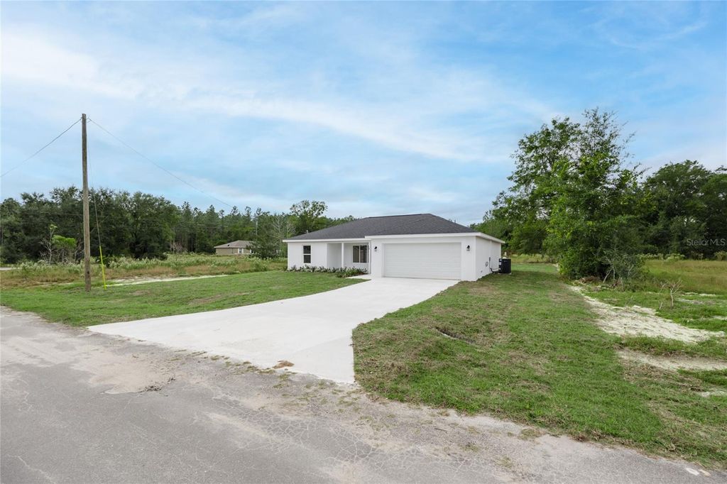 Photo of 18 Malauka Loop Pass, Ocklawaha, FL 32179 (MLS # GC529532)