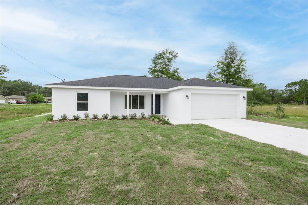 Photo of 18 Malauka Loop Pass, Ocklawaha, FL 32179 (MLS # GC529532)