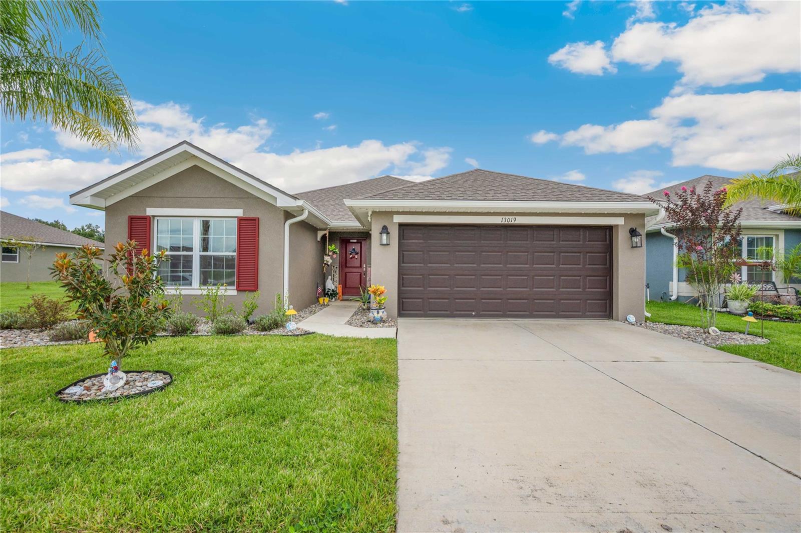 Welcome to this beautifully maintained 4-bedroom, 2-bath home located in the sought-after community of Abbey Glen in Dade City! Built in 2020, this move-in ready home offers a bright, open-concept layout with stylish finishes throughout. The spacious kitchen features white cabinetry, granite countertops, stainless steel appliances, a large island with breakfast bar seating, and a walk-in pantry—perfect for both everyday living and entertaining. The home boasts tile flooring throughout the main living areas and plush carpet in the bedrooms for added comfort. The oversized living room offers a cozy gathering space, while the additional flex room is ideal for a home office, media room, or playroom. Enjoy peaceful mornings and relaxing evenings in the screened-in lanai overlooking a serene, green backyard with no rear neighbors—just tranquil nature views! The primary suite includes a walk-in closet and a spacious en-suite bathroom with dual sinks and a large walk-in shower. Additional features include an indoor laundry room, attached 2-car garage, and upgraded fixtures throughout. Conveniently located near shopping, dining, and major roadways, this home truly has it all! Don’t miss your chance to own this stunning home in a quiet, friendly neighborhood—schedule your private showing today!