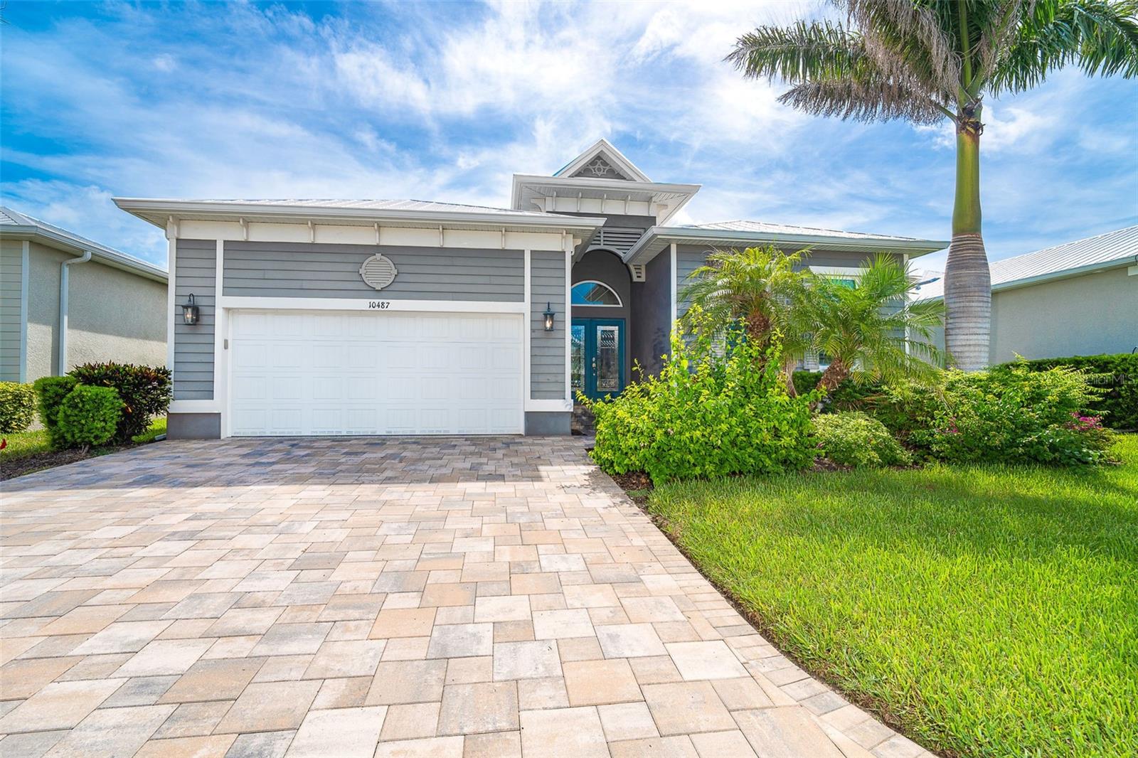 Most Unique Custom Home in Coral Caye – Exceptional Outdoor Living & Luxury Finishes
Welcome to one of the most unique and meticulously crafted custom homes in the exclusive gated community of Coral Caye, located just minutes from the white sand beaches of Boca Grande. This 3-bedroom, 3.5-bath masterpiece blends refined architectural details with serene outdoor living to create a true Florida lifestyle experience.
Step through custom leaded-glass French doors into your own private garden courtyard, complete with a tranquil bubbling fountain. The entry to the main home features a second set of French doors that open to wide-plank French white oak flooring and a bright, open layout that exudes sophistication and warmth.
The expansive great room is the heart of the home, highlighted by a custom-crafted feature wall with elegant built-in cabinetry and shelving. Dramatic ceiling treatments add architectural depth to the great room, entryway, primary suite, and cabana bedroom ceilings, while crown molding and custom beadboard trim accent the living areas throughout.
The gourmet kitchen is a chef’s dream, showcasing upgraded cabinetry with 48" uppers, glass-lit display cabinet, pull-outs, and extra drawers for smart storage. Beautiful granite countertops and backsplash, high-end appliances, and custom lighting and fans elevate every detail. The adjacent dining area features a stunning built-in with cabinetry and mirror, perfect for hosting and entertaining.
Retreat to the elegant primary suite, where you’ll find custom wall treatments, spa-like finishes, private water closet, and a luxurious frameless glass shower. Two additional bedrooms, including a cabana guest suite with private entry, offer comfort and privacy. A custom-designed laundry room includes upper and lower cabinetry, a built-in sink, and extra storage.
Step outside to your private paradise – a Pebble Tec heated saltwater pool and spa, all enclosed in a sprawling clear-view lanai cage that overlooks peaceful preserve views. Enjoy the convenience of a pool bath, perfect for entertaining. The home also features an epoxy-finished garage floor with custom cabinetry and a storage system, a metal roof, impact windows and doors, upgraded landscaping, and designer window treatments throughout.
Built in 2018 and immaculately maintained, this home is and move-in ready. Electric Storm Smart roll down shutters for the lanai provides additional storage and protection.
Coral Caye offers resort-style amenities, including a beautiful clubhouse, heated community pool, pickleball courts, and a state-of-the-art fitness center – all maintenance-free and surrounded by serene preserves. Close to beaches, biking trails, kayaking, boating, golfing, dining, shopping, and world-class fishing, this location offers the best of Southwest Florida living. Minutes from Boca Grande,
Experience the ultimate in custom design and outdoor living—schedule your private showing today.