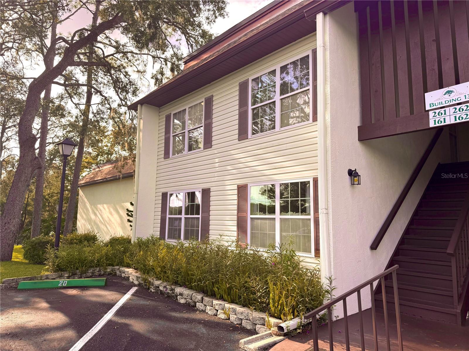 One or more photo(s) has been virtually staged. $2500 FLOORING ALLOWANCE! Easy carefree living in the city limits of Inverness.. This FIRST FLOOR unit has a lovely view of the courtyard and clubhouse from the large screened in lanai. The community pool is down the path in the next court yard. Each 4 units share a washer and dryer so they are just steps away in the back, and parking is a few feet away in the front, just past your easily accessible mailbox. There's no need to stress because building maintenance is included with the HOA fee, as well as wifi, cable, trash pickup, water, and septic. Your only job is to enjoy the new friends you will make at the clubhouse!