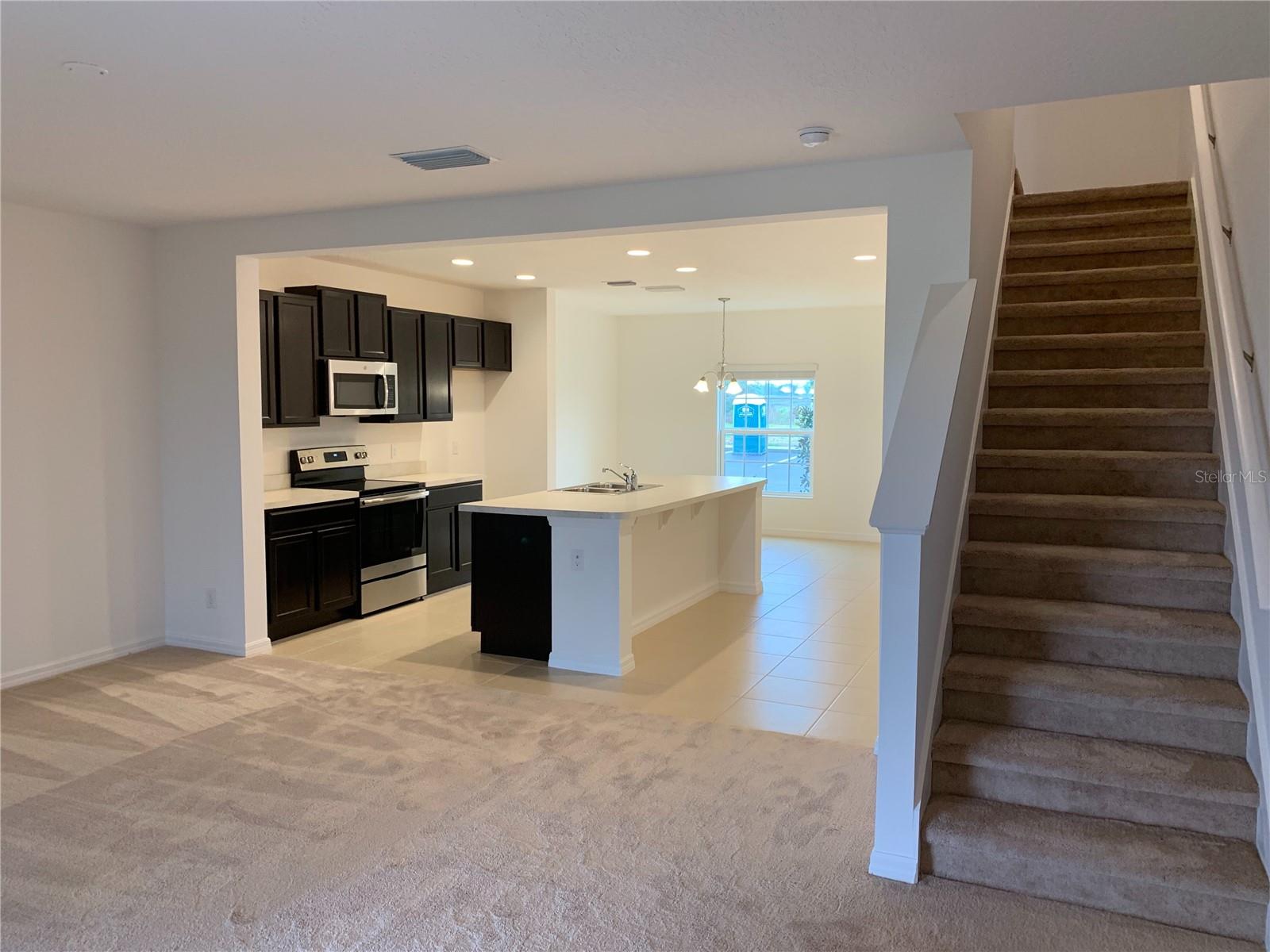 $200 off 1st month's rent! This lovely two story townhouse is beautifully laid out and jam-packed with great features with 3 bedrooms and 2.5 baths- with an updated kitchen and covered lanai to top it off! Clean carpeting is found through the bedrooms, living space, and stairways. Tile found within the kitchen and dining space to ensure quick cleanup. The Kitchen offers dark toned cabinets to compliment the contrasting island, tile and wall colors. Upstairs you will also find your laundry space- ensuring you painless laundry days! Williams Preserve is a welcoming neighborhood that also provides a community pool, playground, and is safely gated for your peace of mind. Renter's Insurance Required.