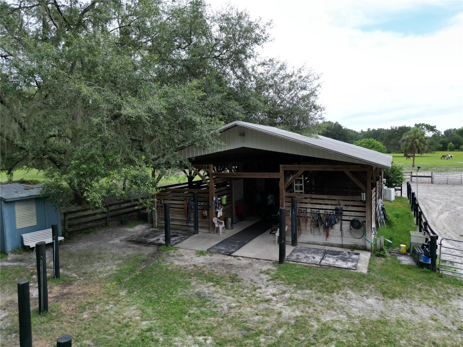 Check out this awesome 10-acre horse property! It’s got everything you need — two riding rings, a round pen, and a 6-stall barn with wash racks, a tack room, and even an office space. The pastures are wide open and ready for your horses to roam. Whether you're training, boarding, or just living the farm life, this place has all the space and setup you need. Tucked in the peaceful countryside, and located right between Gainesville and Ocala — the perfect spot for easy access to both! There is also a business opportunity, the farm is presently used as a summer horse camp. The saddles, bridles and other tack and equipment are available to purchase making it fairly seamless if you want to continue. This 10 + acres parcel includes barn with electric (has its own pole and meter) is being subdivided off a 16+ acre parcel.