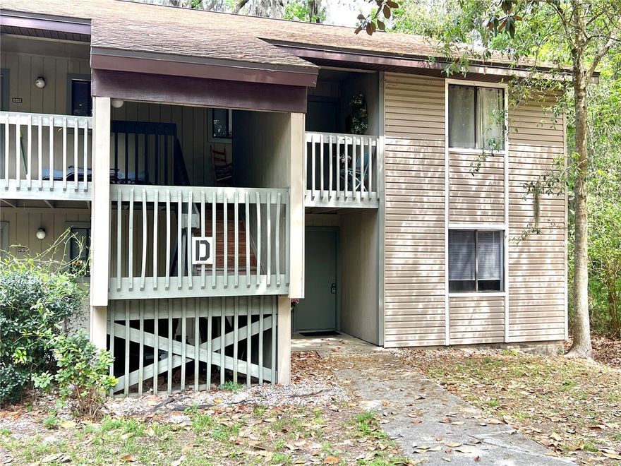 Welcome to this move-in-ready, adorable 2-bedroom, 2-bathroom ground-floor end unit in the Treehouse condominium community. Tucked away in a quiet corner and backing up to a peaceful wooded area, this unit offers both privacy and a serene natural setting. Inside, you’ll find a clean, well-maintained interior with several recent upgrades. The home features luxury vinyl plank flooring throughout the living areas and bedrooms, freshly painted interior walls, and a kitchen with ample cabinet space and granite countertops. Newer vanities and toilets in bathrooms. In-unit washer and dryer. Residents of Treehouse enjoy a variety of community amenities, including two swimming pools, a clubhouse, and a fitness center. The HOA fee covers exterior insurance, maintenance, and roof care. Ideally located near major bus routes, this property offers convenient access to the University of Florida, VA Hospital, Shands Hospital, as well as nearby restaurants and shopping. This is a fantastic opportunity for homeowners or investors seeking a low-maintenance property in a prime location. Call soon to schedule your private showing.