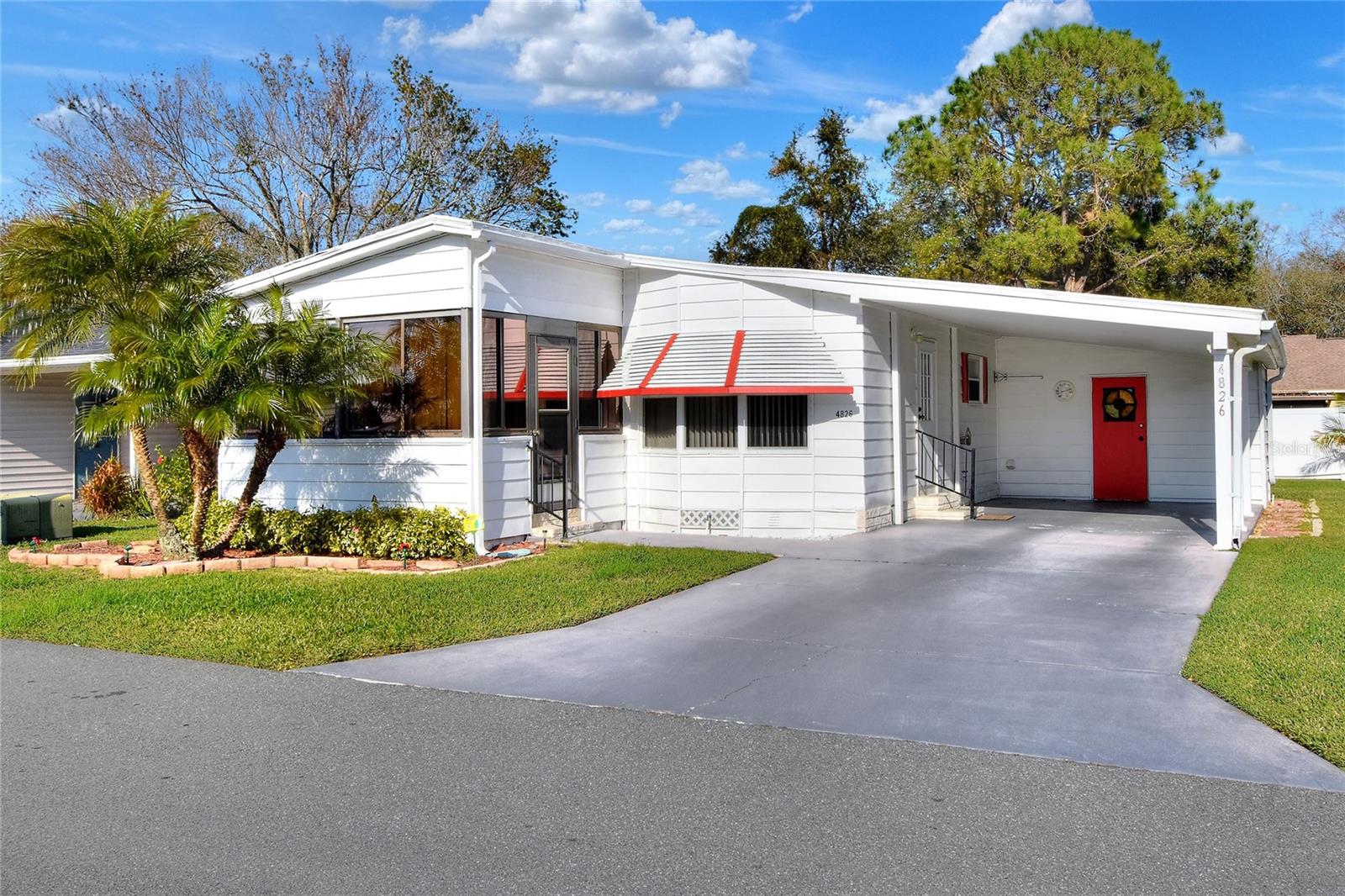 Ready for move in, this gem is located in S Lakeland gated community of Colonnades. 55+, owner occupancy community has low HOA, but SO much in store! Roof placed in 2024, driveway resurfaced in 2024, electrical updated, engineer certified foundation strapping, and she's ready for YOU! The carport is spacious, and beckons you to park there. Entering the residence you see the expansive dining/living combination. The kitchen has additional workspace/breakfast bar & built-in pantry. Laundry is indoors, so no trips from outside in the Florida weather! Private quarters boast a primary with ensuite with vanity, and walk in closet. The front sun room is cooled with a portable a/c unit making this ideal for coffee in the morning, or sunset views in the evening. Why not make this your new home? Call today for a private tour!