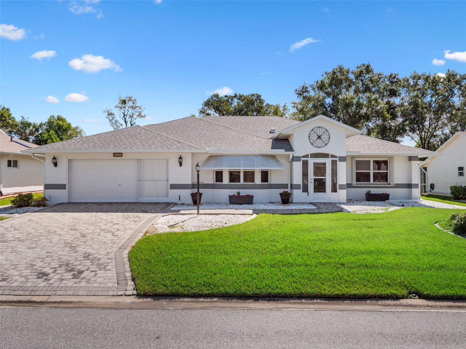 PRICED TO MOVE! RENOVATED single family home in sought after gated active 55+ community of Highland Lakes. BLOCK & STUCCO exterior. Brick paver drive and walk. This well-maintained home features 3 bedrooms, 2 full baths, over 2000 heated square feet and 594 square foot OVER-SIZED garage. An enclosed covered entry opens to the tiled foyer, over-looking an open concept floorplan with 12-foot ceilings in the living room and dining room. The chef in the family will appreciate the large eat-in kitchen with bay window, breakfast bar, granite countertops, stainless appliances, prep island, under-cabinet lighting, dimmable lights, custom wood cornices. The Owner's Retreat features updated en suite bath, walk-in closet and direct access to the Florida Room. On the opposite side of the home, you'll find two additional bedrooms that share an updated full bathroom off the hallway. Custom built Murphy bed and FURNISHINGS OPTIONAL. Beyond the four-season sunroom you may enjoy the outdoor screen enclosed patio, over-looking serene greenspace. Generator with separate breaker & outlet, water purification system, lightning rods, SECO Energy surge protection, Storm Shutters. ROOF 2021. HVAC with new Carbon UV Purifier.
Highland Lakes is a gated 55+ community situated in Central Florida just south of Leesburg & offers residents the following amenities: Recreational Clubhouse with two swimming pools; indoor (heated) & outdoor, a softball field complete with concession stand, an indoor arena with a stage for comm. events, complete kitchen, billiard/ping pong rm., 4 tennis courts (2 courts are lighted), 1 indoor tennis court, 8 lighted shuffle board courts, bocce ball courts, 2 outdoor and 4 indoor pickleball courts, 7 horseshoe pits, covered picnic pavilion with picnic tables & grills to barbeque, library, meeting/card room, exercise room/fitness, craft room, golf driving range, RV/boat storage (included in HOA) & has 260 spaces on a secured lot (fenced & lockable), a Craftsmen building/woodworking shop (homeowners can join the club for only $12 annually and use any/all tools available), there's also a Nature Trail within the community & seven lakes scattered throughout Highland Lakes; 4 are used by residents for catch & release fishing! Don't wait............. call now to schedule your private tour!