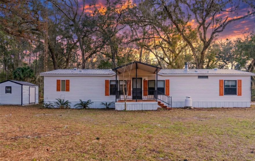 RARE EQUESTRIAN OPPORTUNITY with DIRECT TRAIL ACCESS! Discover the perfect blend of affordability and prime location on this 5-acre equestrian estate, situated just minutes from the World Equestrian Center and less than 3 miles from the Florida Horse Park. This unique property offers the ultimate rider’s lifestyle with a personal gate providing direct access to the famous Santos Horse Trails. The grounds are fully equipped for your animals, featuring an 8-stall barn with water and electricity, a round pen, two large paddocks, and four smaller paddocks—all with running water and plenty of mature shade trees. The estate boasts two independent residences, each serviced by its own well and septic system, making it ideal for multi-generational living or a boarding/rental opportunity.
The first home offers over 1,500 total square feet, featuring a cozy wood-burning fireplace, LVP flooring, and a durable metal roof. Major systems including the HVAC, ductwork, water heater, and stainless steel appliances were all updated within the last 2 to 5 years for peace of mind. The second residence is even more spacious, boasting over 2,000 total square feet and a wealth of recent renovations. This home features a brand-new roof (2025), a gas fireplace, skylights, and wood cabinetry. The interior was recently refreshed with new LVP flooring, tape-and-textured walls with crown molding, new vanities, and updated stainless steel appliances (excluding oven) and a new sink. Whether you are looking for a muti-generational compound, an income-producing rental, a private homestead or a functional boarding facility, this property delivers "newness" and convenience in the heart of Florida’s horse country.